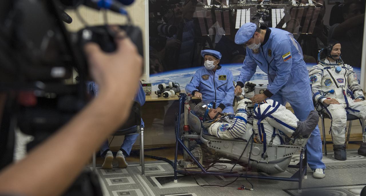 Expedition 60 Soyuz Commander Alexander Skvortsov or Roscosmos prepares to have his Russian Sokol suit pressure checked in preparation for launch aboard the Soyuz MS-13 spacecraft, Saturday, July 20, 2019 at the Baikonur Cosmodrome in Kazakhstan. Skvortsov, Andrew Morgan of NASA and Luca Parmitano of ESA (European Space Agency) launched aboard the Soyuz MS-13 spacecraft at 12:28 p.m. Eastern time (9:28 p.m. Baikonur time) on July 20 to begin their journey to the International Space Station. Photo Credit: (NASA/Joel Kowsky)