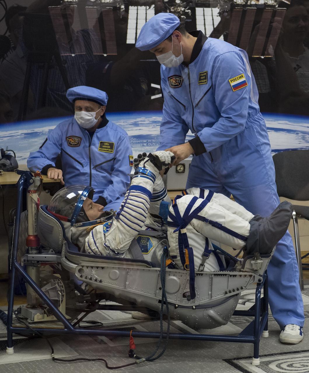 Expedition 60 flight engineer Andrew Morgan of NASA prepares to have his Russian Sokol suit pressure checked in preparation for launch aboard the Soyuz MS-13 spacecraft, Saturday, July 20, 2019 at the Baikonur Cosmodrome in Kazakhstan. Morgan, Alexander Skvortsov of Roscosmos, and Luca Parmitano of ESA (European Space Agency) launched aboard the Soyuz MS-13 spacecraft at 12:28 p.m. Eastern time (9:28 p.m. Baikonur time) on July 20 to begin their journey to the International Space Station. Photo Credit: (NASA/Joel Kowsky)