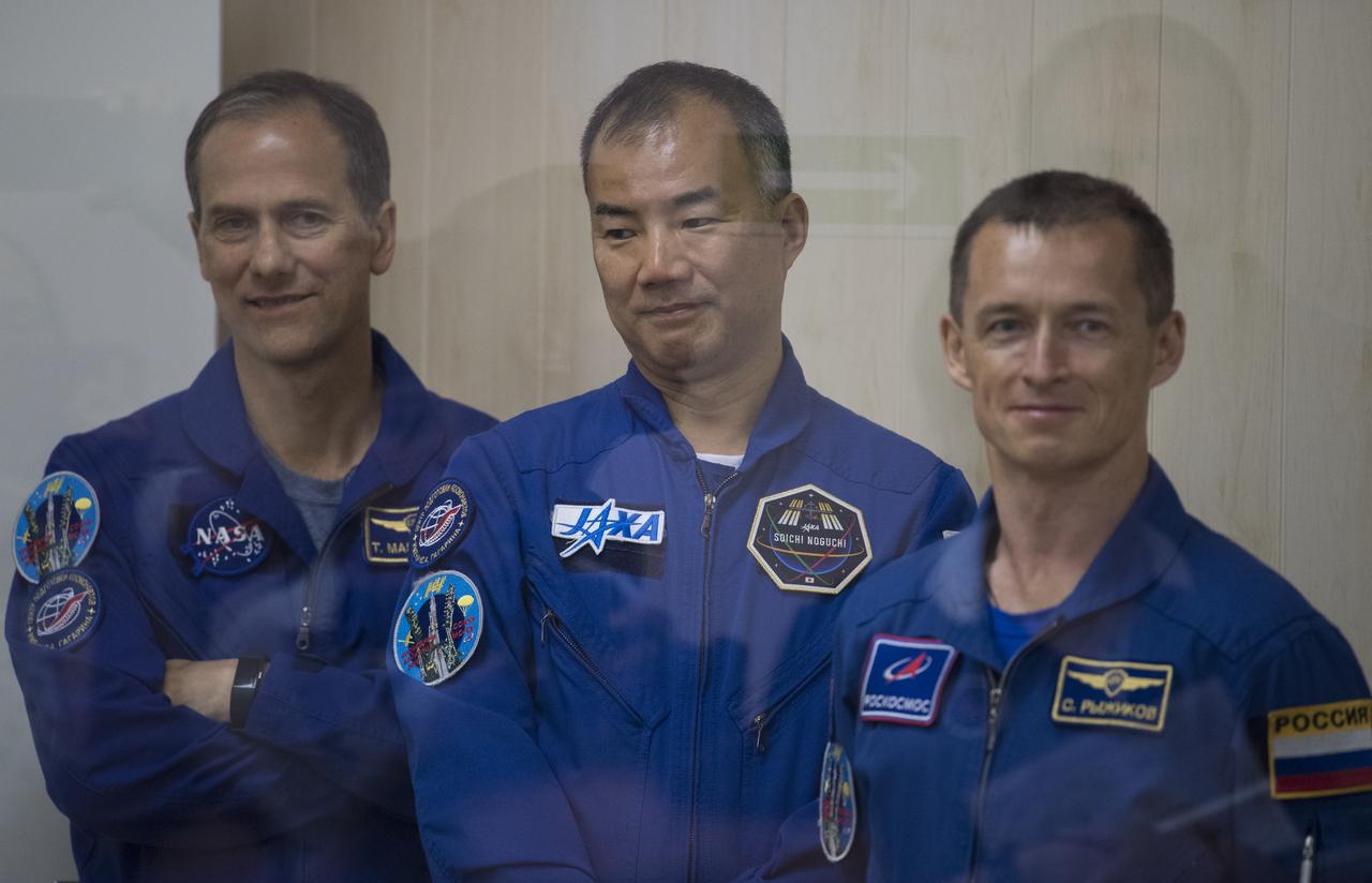Expedition 60 backup crew members Thomas Marshburn of NASA, left, Soichi Noguchi of the Japan Aerospace Exploration Agency (JAXA), center, and Sergey Ryzhikov of Roscosmos, right, are seen as prime crew members Alexander Skvortsov of Roscosmos, Andrew Morgan of NASA, and Luca Parmitano of ESA (European Space Agency) have their Russian Sokol suits pressure checked in preparation for launch aboard the Soyuz MS-13 spacecraft, Saturday, July 20, 2019 at the Baikonur Cosmodrome in Kazakhstan. Skvortsov, Morgan, and Parmitano launched aboard the Soyuz MS-13 spacecraft at 12:28 p.m. Eastern time (9:28 p.m. Baikonur time) on July 20 to begin their journey to the International Space Station.  Photo Credit: (NASA/Joel Kowsky)