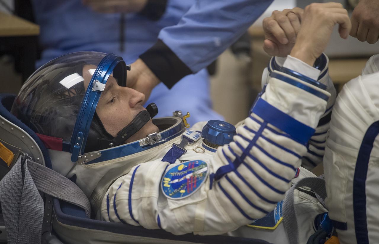Expedition 60 flight engineer Andrew Morgan of NASA prepares to have his Russian Sokol suit pressure checked in preparation for launch aboard the Soyuz MS-13 spacecraft, Saturday, July 20, 2019 at the Baikonur Cosmodrome in Kazakhstan. Morgan, Alexander Skvortsov of Roscosmos, and Luca Parmitano of ESA (European Space Agency) launched aboard the Soyuz MS-13 spacecraft at 12:28 p.m. Eastern time (9:28 p.m. Baikonur time) on July 20 to begin their journey to the International Space Station. Photo Credit: (NASA/Joel Kowsky)