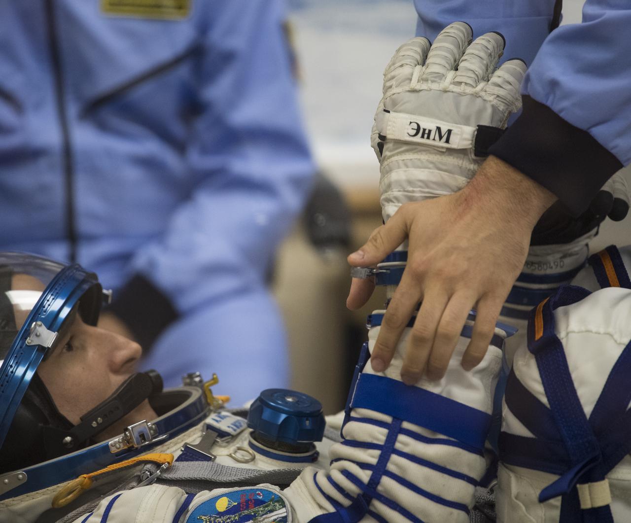 Expedition 60 flight engineer Andrew Morgan of NASA prepares to have his Russian Sokol suit pressure checked in preparation for launch aboard the Soyuz MS-13 spacecraft, Saturday, July 20, 2019 at the Baikonur Cosmodrome in Kazakhstan. Morgan, Alexander Skvortsov of Roscosmos, and Luca Parmitano of ESA (European Space Agency) launched aboard the Soyuz MS-13 spacecraft at 12:28 p.m. Eastern time (9:28 p.m. Baikonur time) on July 20 to begin their journey to the International Space Station. Photo Credit: (NASA/Joel Kowsky)