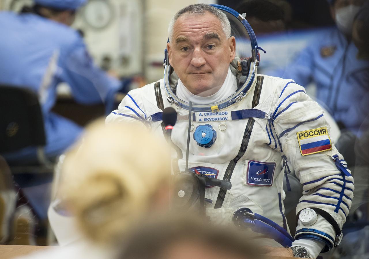 Expedition 60 Soyuz Commander Alexander Skvortsov of Roscosmos speaks with family after having his Russian Sokol suit pressure checked in preparation for launch aboard the Soyuz MS-13 spacecraft, Saturday, July 20, 2019 at the Baikonur Cosmodrome in Kazakhstan. Skvortsov, Andrew Morgan of NASA, and Luca Parmitano of ESA (European Space Agency) launched aboard the Soyuz MS-13 spacecraft at 12:28 p.m. Eastern time (9:28 p.m. Baikonur time) on July 20 to begin their journey to the International Space Station. Photo Credit: (NASA/Joel Kowsky)