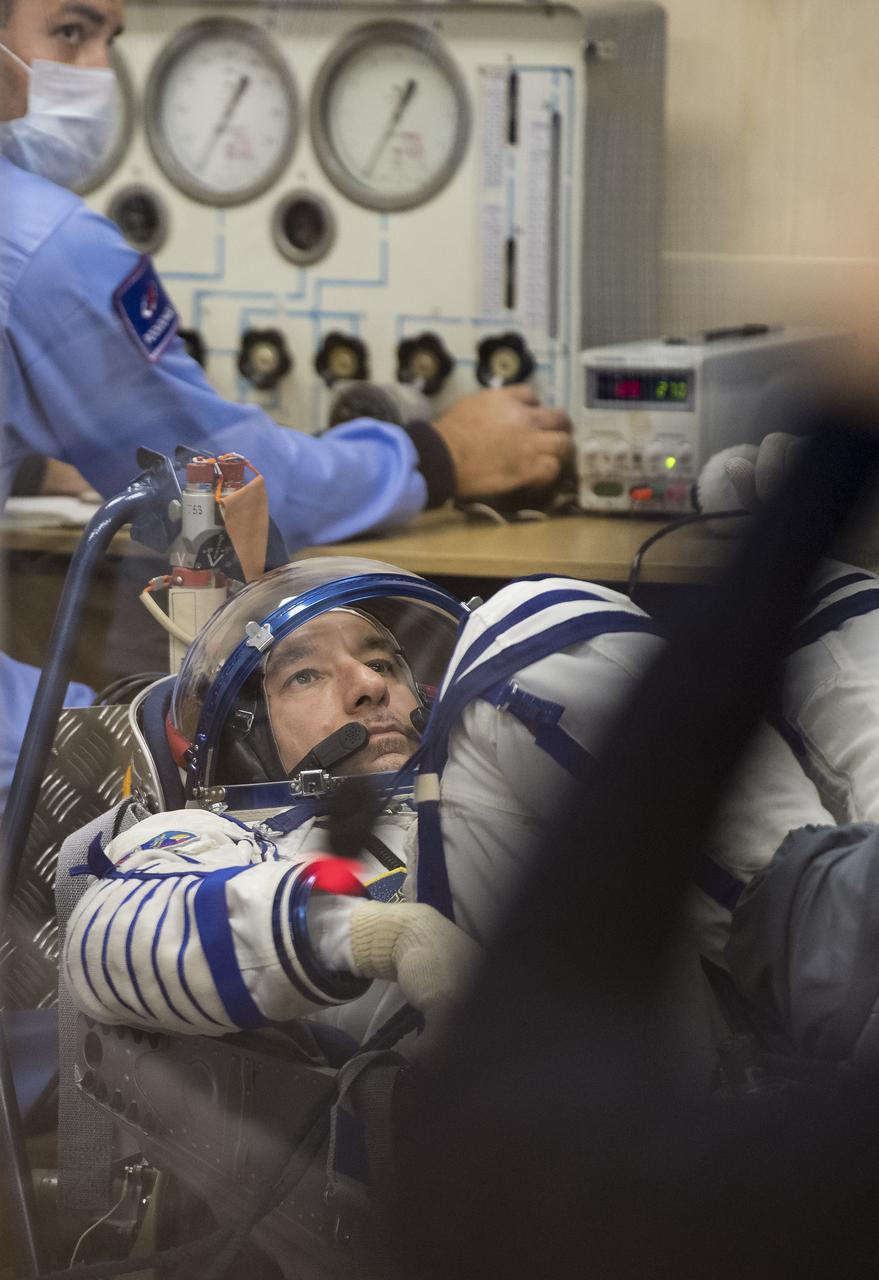 Expedition 60 flight engineer Luca Parmitano of ESA (European Space Agency) prepares to have his Russian Sokol suit pressure checked in preparation for launch aboard the Soyuz MS-13 spacecraft, Saturday, July 20, 2019 at the Baikonur Cosmodrome in Kazakhstan. Parmitano, Alexander Skvortsov of Roscosmos, and Andrew Morgan of NASA launched aboard the Soyuz MS-13 spacecraft at 12:28 p.m. Eastern time (9:28 p.m. Baikonur time) on July 20 to begin their journey to the International Space Station. Photo Credit: (NASA/Joel Kowsky)