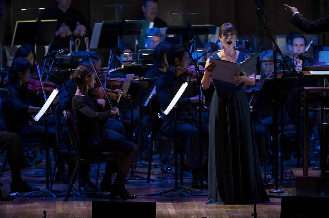 American composer Michael Giacchino's piece titled, "Advent" is performed during the "National Symphony Orchestra Pops, Apollo 11: A 50th Anniversary, One Small Step, One Giant Leap" a program including musical acts, speakers, and images and video related to space, on Saturday, July 20, 2019 at the John F. Kennedy Center for the Performing Arts in Washington. NASA and the country are recognizing the 50th anniversary of Apollo 11, in which astronauts Neil Armstrong, Michael Collins, and Buzz Aldrin crewed the first mission to land astronauts on the Moon. Photo Credit: (NASA/Aubrey Gemignani)