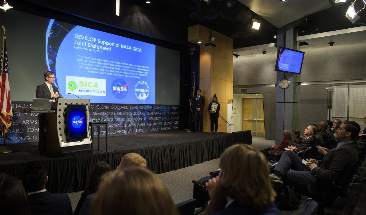 Kenton Ross, DEVELOP's National Science Advisor, speaks about SICA during the 2019 Annual Earth Science Applications Showcase, Thursday, Aug. 1, 2019 at NASA Headquarters in Washington, DC. Every summer students and young professionals from NASA’s Applied Sciences’ DEVELOP National Program come to NASA Headquarters and present their research projects. DEVELOP is a training and development program where students work on Earth science research projects, mentored by science advisers from NASA and partner agencies, and extend research results to local communities. Photo Credit: (NASA/Joel Kowsky)