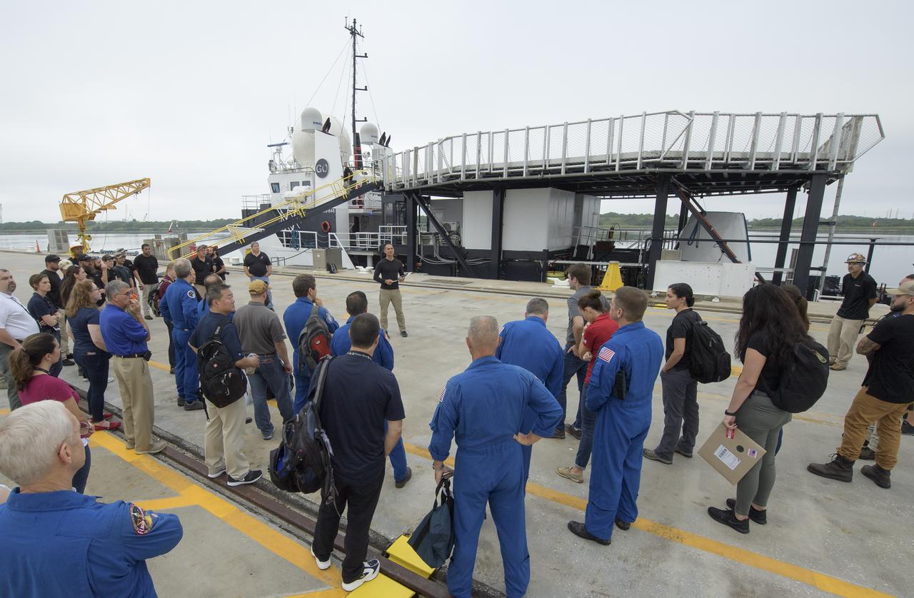 Teams from NASA and SpaceX gather at the Trident Basin in Cape Canaveral, Florida, on August 13, 2019 to rehearse extracting astronauts from SpaceX’s Crew Dragon, which will be used to carry humans to the International Space Station. Using the Go Searcher ship SpaceX uses to recover their spacecraft after splashdown and a mock-up of the Crew Dragon, the teams worked through the steps necessary to get NASA astronauts Doug Hurley and Bob Behnken out of the Dragon and back to dry land. Hurley and Behnken will fly to the space station aboard the Crew Dragon for the SpaceX Demo-2 mission. Photo Credit: (NASA/Bill Ingalls)