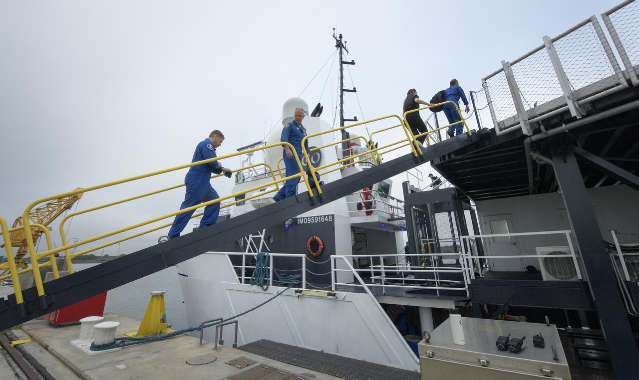 NASA astronauts Bob Behnken, left, and Doug Hurley board the SpaceX GO Searcher ship at the Trident Basin in Cape Canaveral, Florida, on August 13, 2019 to rehearse extracting astronauts from SpaceX’s Crew Dragon, which will be used to carry humans to the International Space Station. Using the Go Searcher ship SpaceX uses to recover their spacecraft after splashdown and a mock-up of the Crew Dragon, the teams worked through the steps necessary to get NASA astronauts Doug Hurley and Bob Behnken out of the Dragon and back to dry land. Hurley and Behnken will fly to the space station aboard the Crew Dragon for the SpaceX Demo-2 mission. Photo Credit: (NASA/Bill Ingalls)