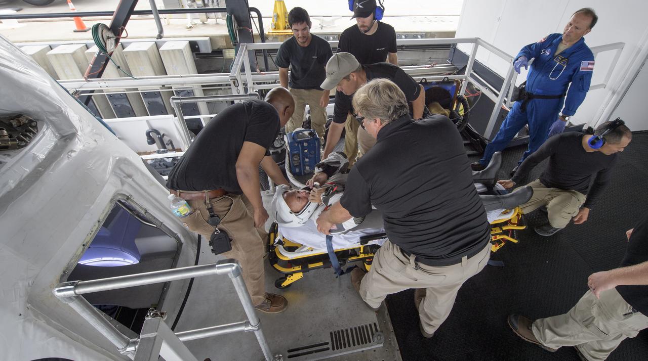 NASA astronaut Doug Hurley, along with teams from NASA and SpaceX, rehearse crew extraction from SpaceX’s Crew Dragon, which will be used to carry humans to the International Space Station, on August 13, 2019 at the Trident Basin in Cape Canaveral, Florida. Using the Go Searcher ship SpaceX uses to recover their spacecraft after splashdown and a mock-up of the Crew Dragon, the teams worked through the steps necessary to get NASA astronauts Doug Hurley and Bob Behnken out of the Dragon and back to dry land. Hurley and Behnken will fly to the space station aboard the Crew Dragon for the SpaceX Demo-2 mission. Photo Credit: (NASA/Bill Ingalls)