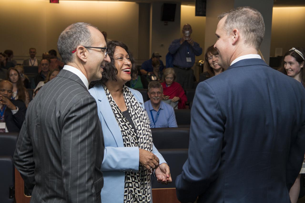 NASA Administrator Jim Bridenstine, right, speaks with President and CEO of the Challenger Center, Lance Bush, left, and Cheryl McNair, the widow of Challenger astronaut Ron McNair, after giving keynote remarks at the Challenger Center Annual Conference, Wednesday, August 14, 2019 at the Lockheed Martin Global Vision Center in Arlington, VA. Photo Credit: (NASA/Aubrey Gemignani)