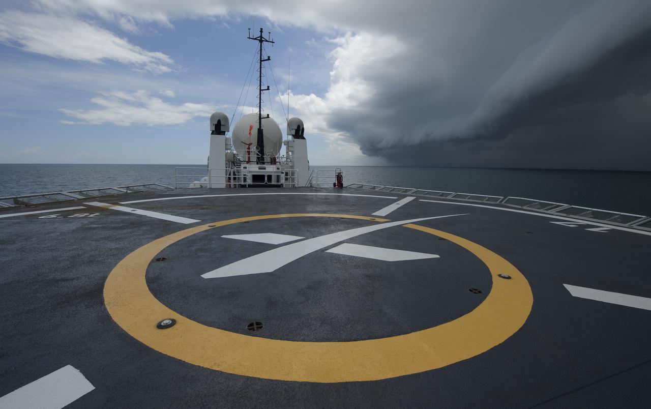 A quick moving storm passes as teams from NASA and SpaceX practice procedures for medical emergency evacuation onboard the GO Searcher ship, Friday, August 15, 2019 in the Atlantic Ocean off the coast of Cape Canaveral, Florida. SpaceX will use the GO Searcher ship during the Demo-2 mission to recover NASA astronauts returning from the International Space Station in their Crew Dragon spacecraft. Photo Credit: (NASA/Bill Ingalls)