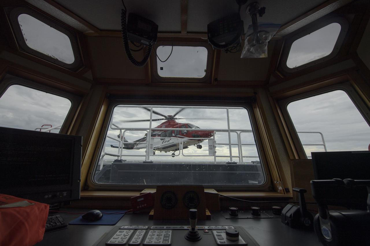 A helicopter equipped for air medical operations lands on the GO Searcher ship as teams from NASA and SpaceX practice procedures for medical emergency evacuation, Friday, August 15, 2019 in the Atlantic Ocean off the coast of Cape Canaveral, Florida. SpaceX will use the GO Searcher ship during the Demo-2 mission to recover NASA astronauts returning from the International Space Station in their Crew Dragon spacecraft. Photo Credit: (NASA/Bill Ingalls)