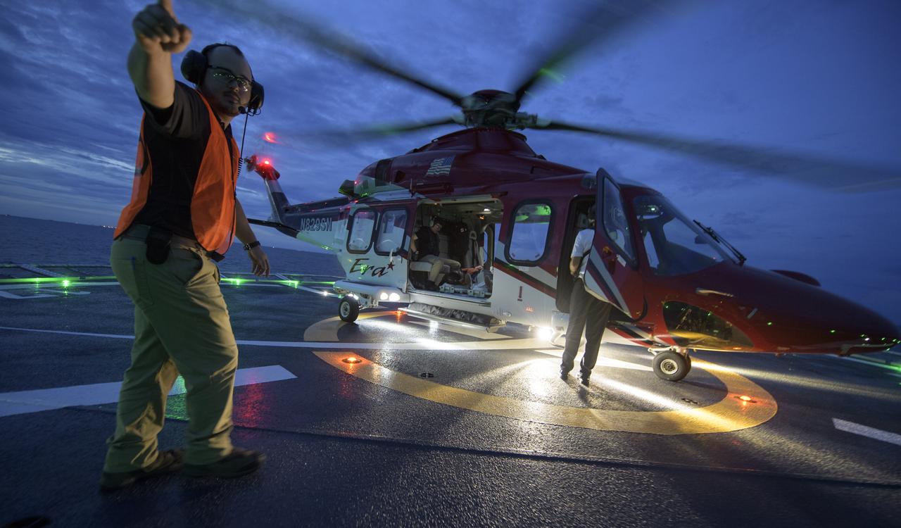Teams from NASA and SpaceX practice procedures for medical emergency evacuation onboard the GO Searcher ship, Friday, August 15, 2019 in the Atlantic Ocean off the coast of Cape Canaveral, Florida. SpaceX will use the GO Searcher ship during the Demo-2 mission to recover NASA astronauts returning from the International Space Station in their Crew Dragon spacecraft. Photo Credit: (NASA/Bill Ingalls)
