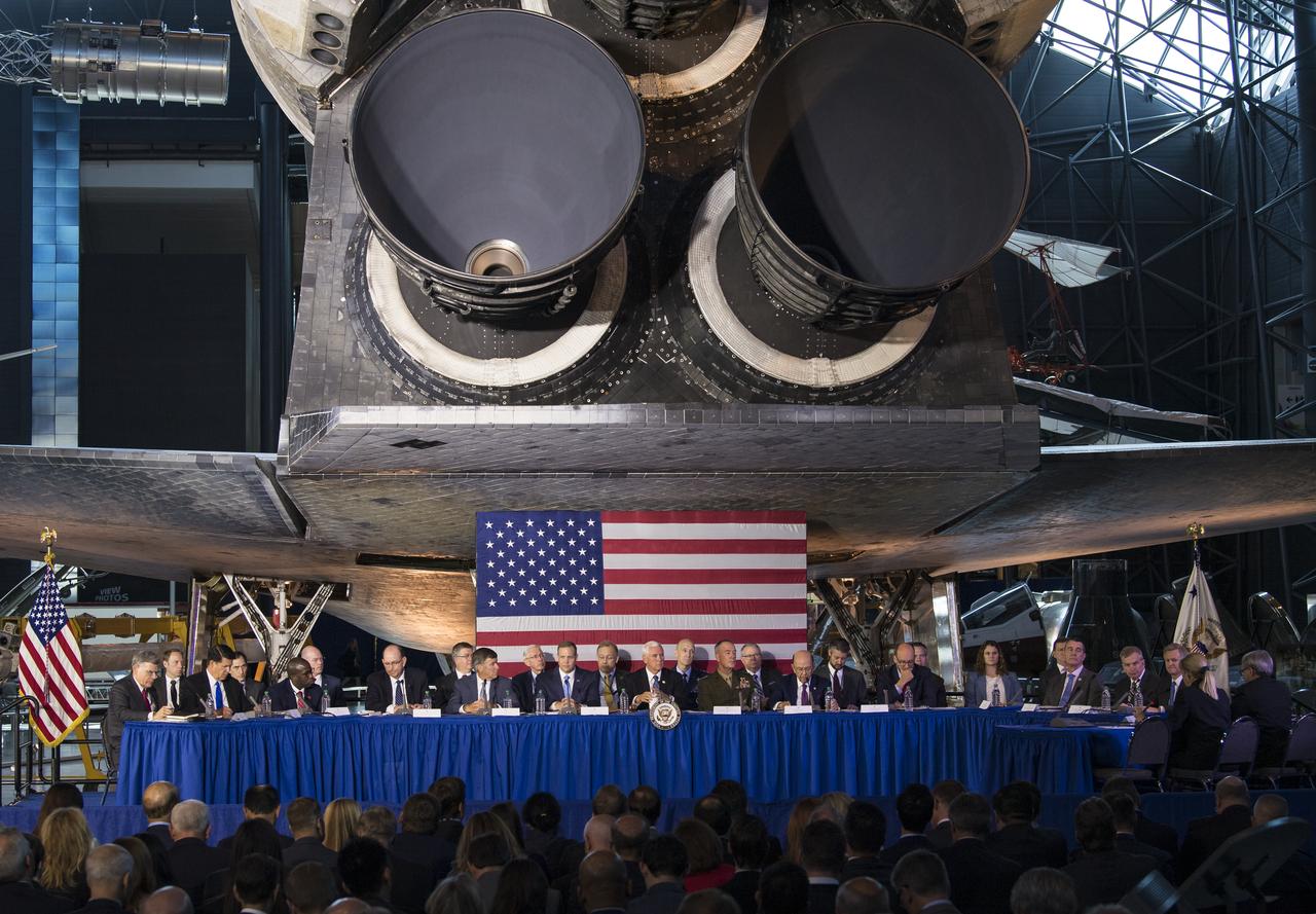 Members of the National Space Council listen to an update on the council's Users Advisory Group during the sixth meeting of the National Space Council, Tuesday, Aug. 20, 2019 at the Smithsonian National Air and Space Museum's Steven F. Udvar-Hazy Center in Chantilly, Va. Chaired by the Vice President, the council's role is to advise the President regarding national space policy and strategy, and review the nation's long-range goals for space activities. Photo Credit: (NASA/Aubrey Gemignani)
