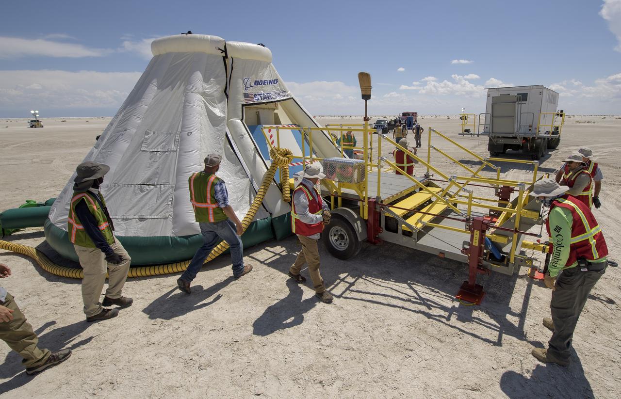 Teams from NASA, Boeing and the White Sands Missile Range, rehearse landing and crew extraction from Boeing’s CST-100 Starliner, which will be used to carry humans to the International Space Station, on Monday, Sept. 9, 2019 at the White Sands Missile Range outside Las Cruces, New Mexico. Using a convoy of vehicles Boeing uses to recover their spacecraft after landing and a boiler plate test article of the Starliner capsule, the teams worked through the steps necessary to safe the vehicle and get future crew members out of the Starliner to return home. NASA astronauts Mike Fincke and Nicole Mann and Boeing astronaut Chris Ferguson will fly to the space station aboard the Starliner for the Boeing Crew Flight Test mission. Photo Credit: (NASA/Bill Ingalls)