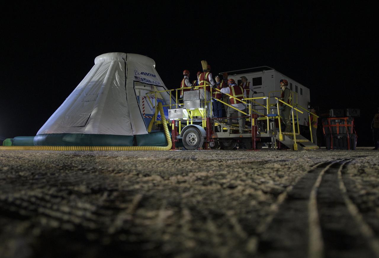 Teams from NASA, Boeing and the White Sands Missile Range, rehearse landing and crew extraction from Boeing’s CST-100 Starliner, which will be used to carry humans to the International Space Station, on Tuesday, Sept. 10, 2019 at the White Sands Missile Range outside Las Cruces, New Mexico. Using a convoy of vehicles Boeing uses to recover their spacecraft after landing and a boiler plate test article of the Starliner capsule, the teams worked through the steps necessary to safe the vehicle and get future crew members out of the Starliner to return home. NASA astronauts Mike Fincke and Nicole Mann and Boeing astronaut Chris Ferguson will fly to the space station aboard the Starliner for the Boeing Crew Flight Test mission. Photo Credit: (NASA/Bill Ingalls)