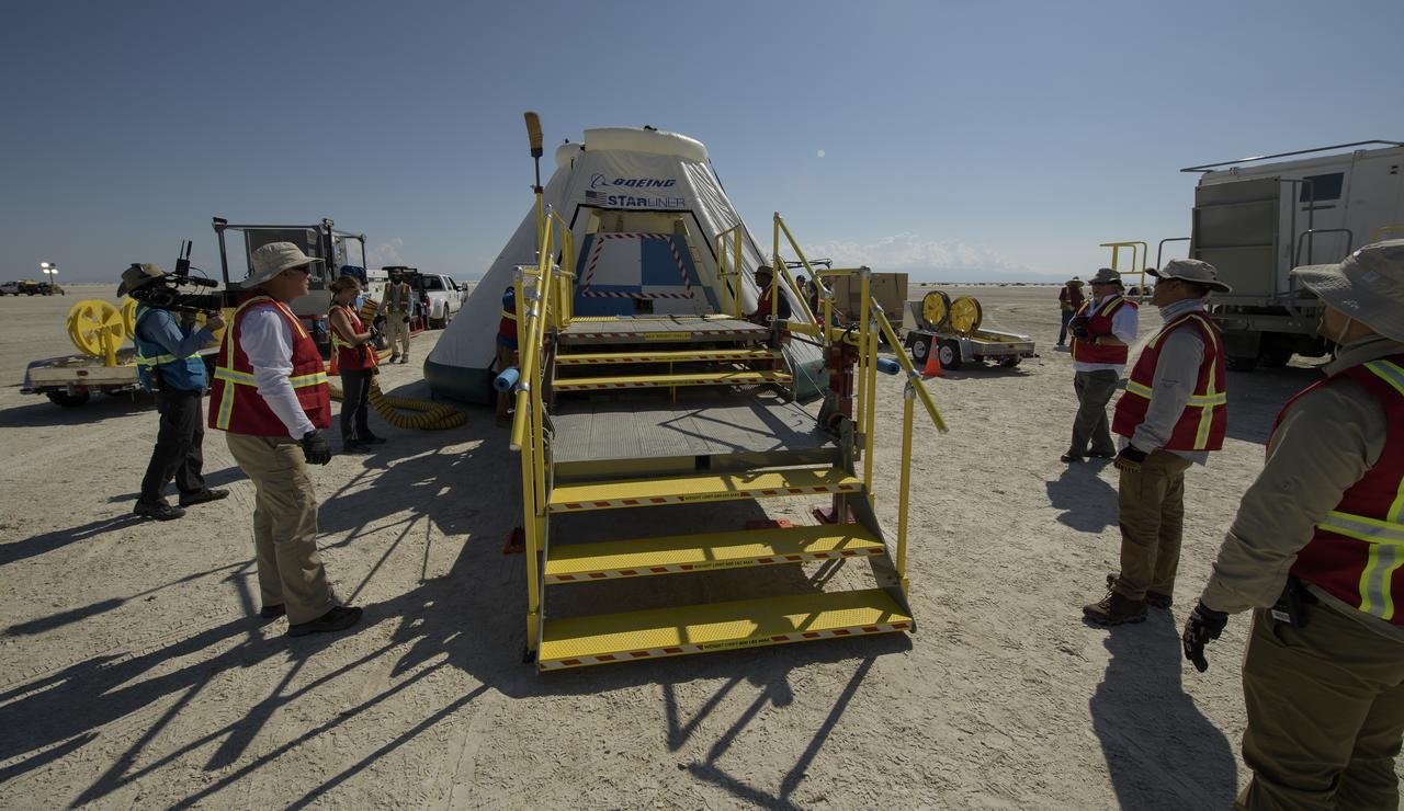 Teams from NASA, Boeing and the White Sands Missile Range, rehearse landing and crew extraction from Boeing’s CST-100 Starliner, which will be used to carry humans to the International Space Station, on Tuesday, Sept. 10, 2019 at the White Sands Missile Range outside Las Cruces, New Mexico. Using a convoy of vehicles Boeing uses to recover their spacecraft after landing and a boiler plate test article of the Starliner capsule, the teams worked through the steps necessary to safe the vehicle and get future crew members out of the Starliner to return home. NASA astronauts Mike Fincke and Nicole Mann and Boeing astronaut Chris Ferguson will fly to the space station aboard the Starliner for the Boeing Crew Flight Test mission. Photo Credit: (NASA/Bill Ingalls)