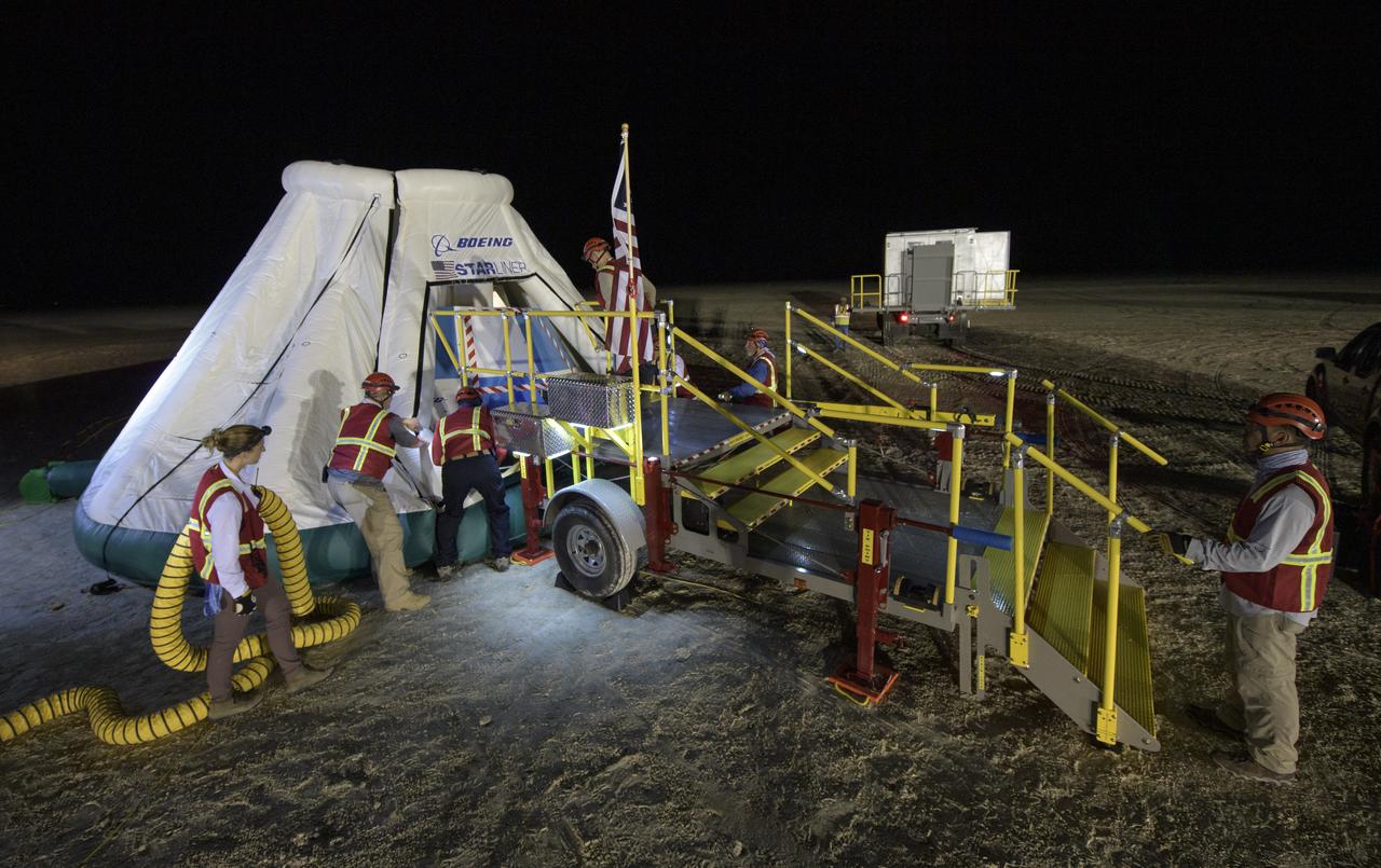 Teams from NASA, Boeing and the White Sands Missile Range, rehearse landing and crew extraction from Boeing’s CST-100 Starliner, which will be used to carry humans to the International Space Station, on Wednesday, Sept. 11, 2019 at the White Sands Missile Range outside Las Cruces, New Mexico. Using a convoy of vehicles Boeing uses to recover their spacecraft after landing and a boiler plate test article of the Starliner capsule, the teams worked through the steps necessary to safe the vehicle and get future crew members out of the Starliner to return home. NASA astronauts Mike Fincke and Nicole Mann and Boeing astronaut Chris Ferguson will fly to the space station aboard the Starliner for the Boeing Crew Flight Test mission. Photo Credit: (NASA/Bill Ingalls)