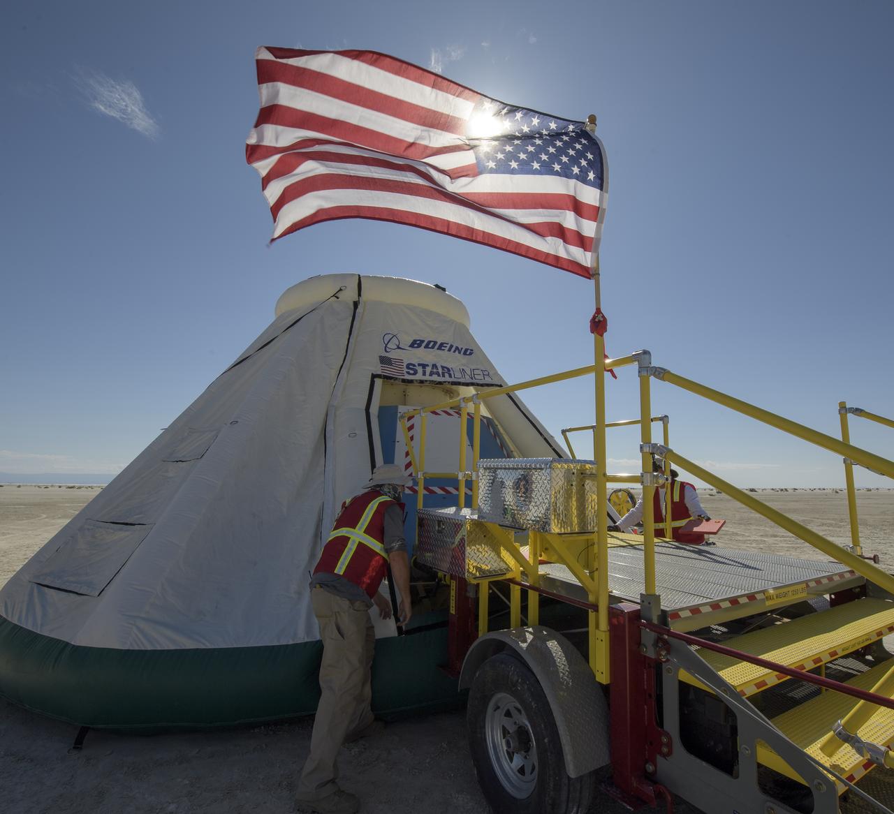 Teams from NASA, Boeing and the White Sands Missile Range, rehearse landing and crew extraction from Boeing’s CST-100 Starliner, which will be used to carry humans to the International Space Station, on Wednesday, Sept. 11, 2019 at the White Sands Missile Range outside Las Cruces, New Mexico. Using a convoy of vehicles Boeing uses to recover their spacecraft after landing and a boiler plate test article of the Starliner capsule, the teams worked through the steps necessary to safe the vehicle and get future crew members out of the Starliner to return home. NASA astronauts Mike Fincke and Nicole Mann and Boeing astronaut Chris Ferguson will fly to the space station aboard the Starliner for the Boeing Crew Flight Test mission. Photo Credit: (NASA/Bill Ingalls)