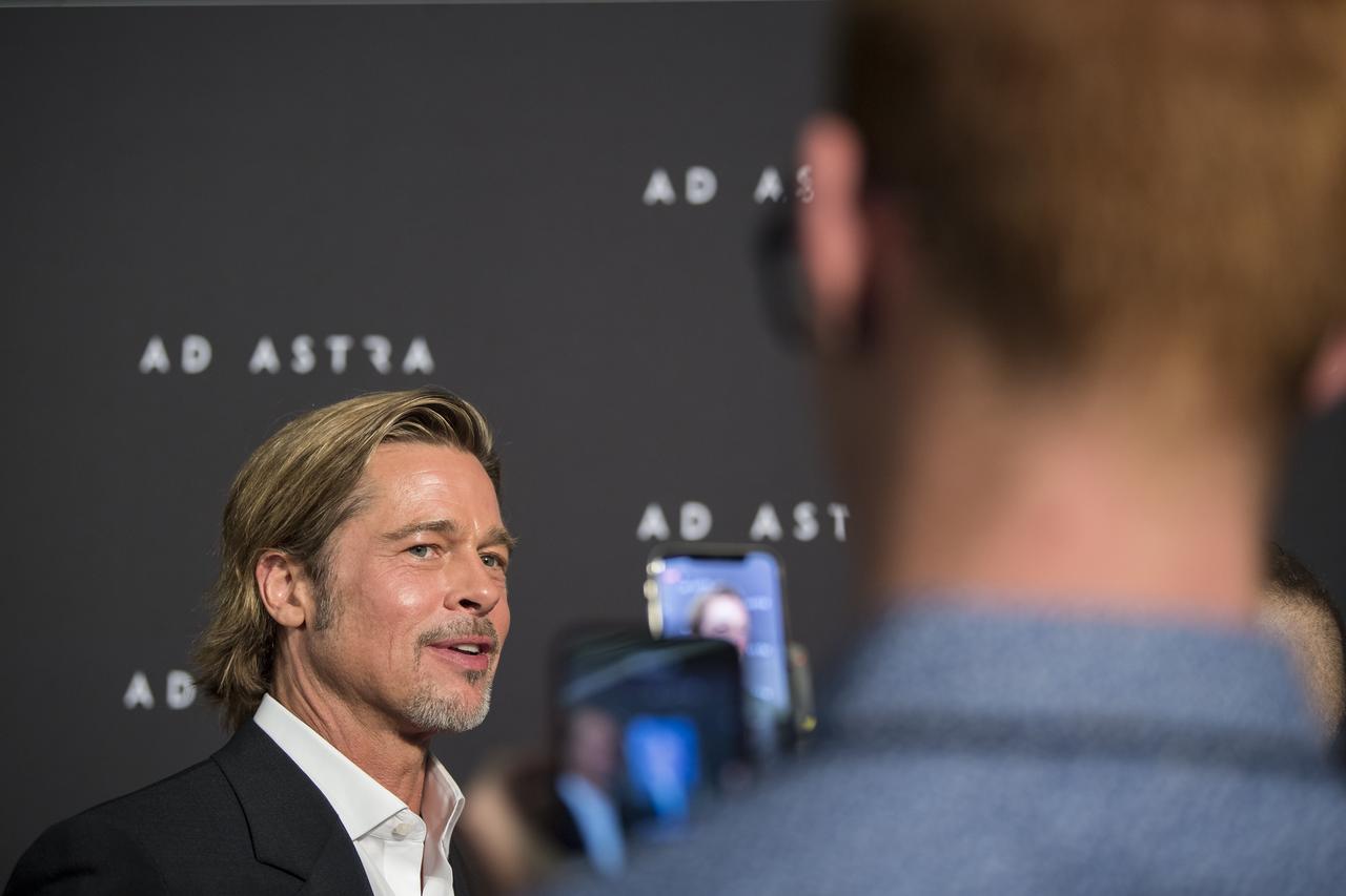 Actor Brad Pitt arrives on the red carpet for a screening of the film "Ad Astra" at National Geographic Society, Monday, September 16, 2019 in Washington. The film was produced, co-written, and directed by James Gray and stars Pitt, Tommy Lee Jones, Ruth Negga, Liv Tyler, and Donald Sutherland. Pitt stars as astronaut Roy McBride who travels deep into the solar system in hopes of solving a mystery that threatens life on Earth. Photo Credit: (NASA/Aubrey Gemignani)