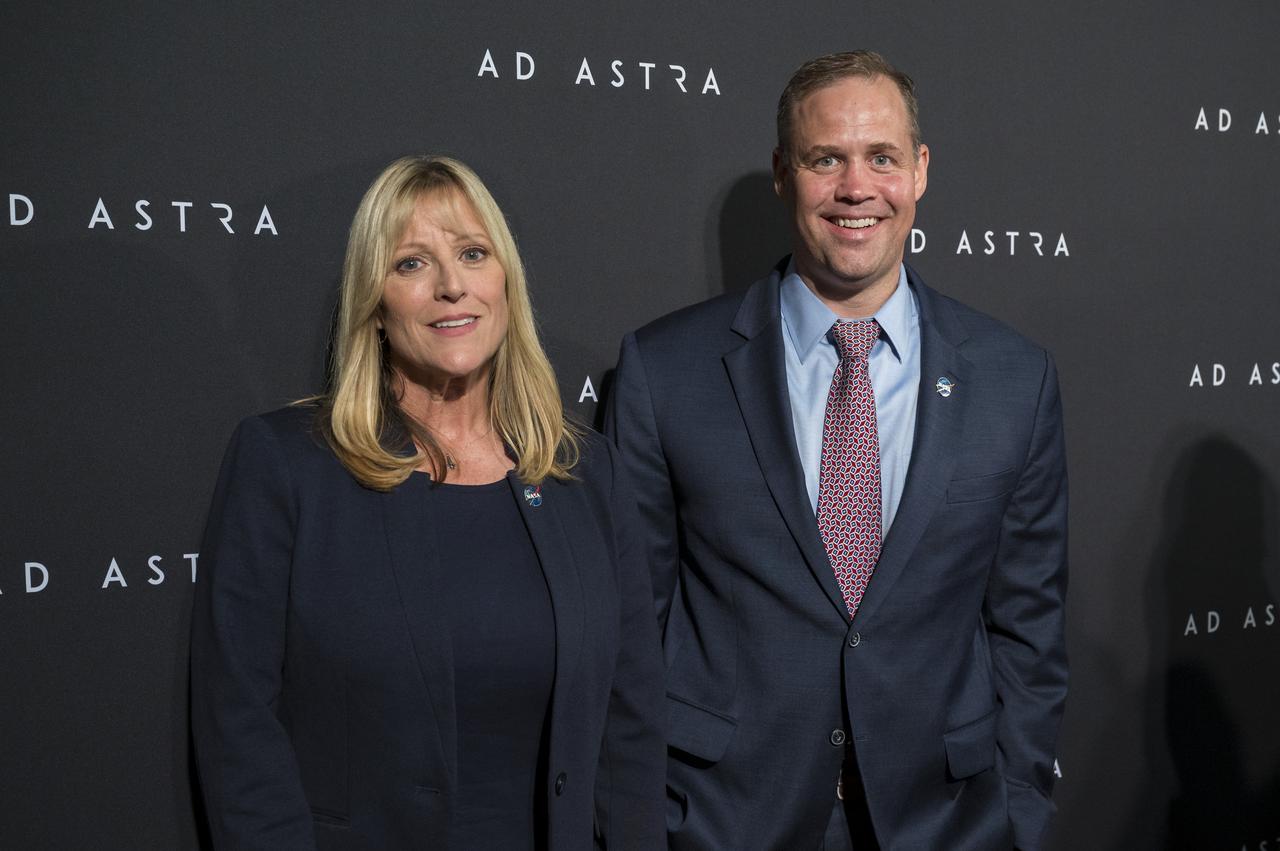 Former NASA astronaut Kay Hire and NASA Administrator Jim Bridenstine pose for a photo on the red carpet during a screening of the film "Ad Astra" at National Geographic Society, Monday, September 16, 2019 in Washington. The film was produced, co-written, and directed by James Gray and stars Jones, Brad Pitt, Ruth Negga, Liv Tyler, and Donald Sutherland. Pitt stars as astronaut Roy McBride who travels deep into the solar system in hopes of solving a mystery that threatens life on Earth. Photo Credit: (NASA/Aubrey Gemignani)