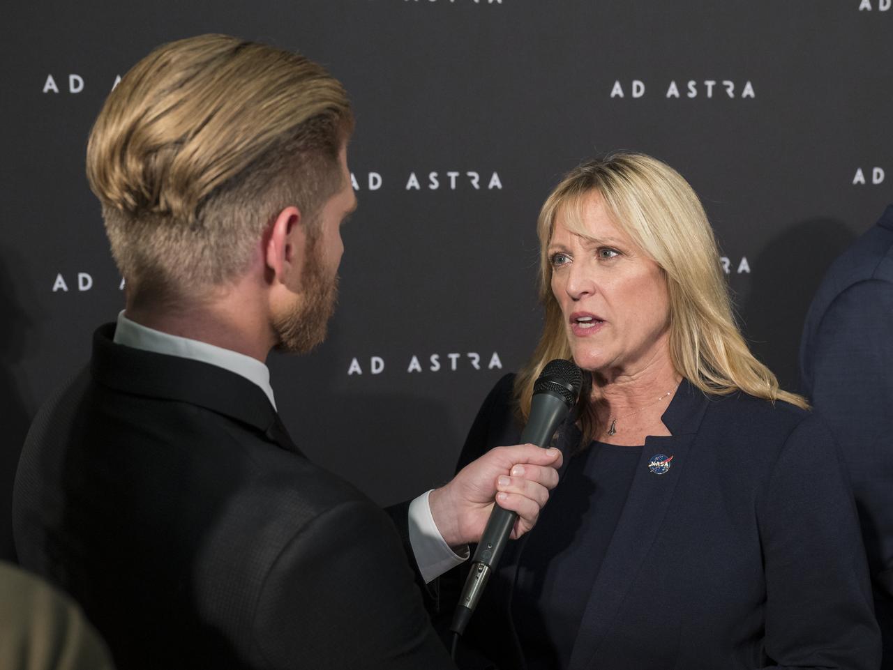 Former NASA astronaut Kay Hire is interviewed on the red carpet during a screening of the film "Ad Astra" at National Geographic Society, Monday, September 16, 2019 in Washington. The film was produced, co-written, and directed by James Gray and stars Brad Pitt, Tommy Lee Jones, Ruth Negga, Liv Tyler, and Donald Sutherland. Pitt stars as astronaut Roy McBride who travels deep into the solar system in hopes of solving a mystery that threatens life on Earth. Photo Credit: (NASA/Aubrey Gemignani)