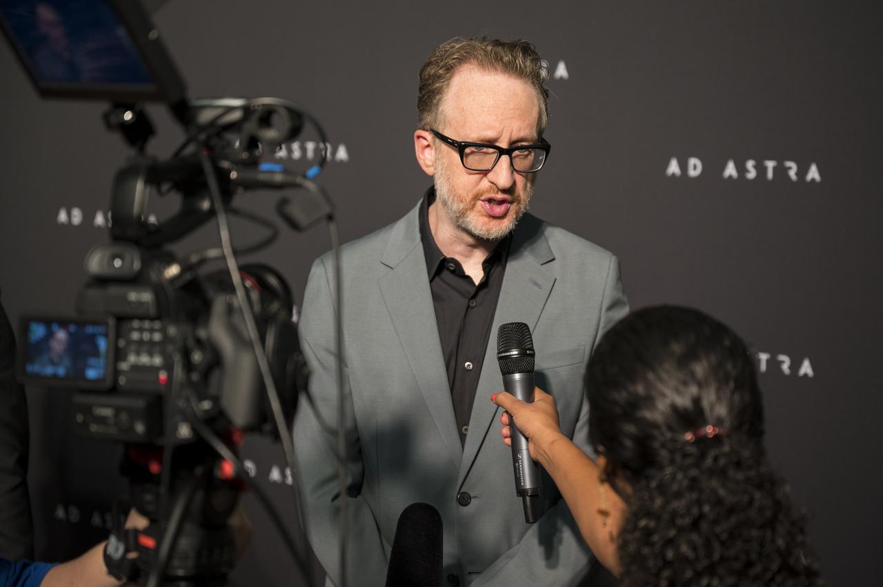 Producer, co-writer, and director James Gray is interviewed by NASA television on the red carpet during a screening of the film "Ad Astra" at National Geographic Society, Monday, September 16, 2019 in Washington. The film stars Tommy Lee Jones, Brad Pitt, Ruth Negga, Liv Tyler, and Donald Sutherland. Pitt stars as astronaut Roy McBride who travels deep into the solar system in hopes of solving a mystery that threatens life on Earth. Photo Credit: (NASA/Aubrey Gemignani)