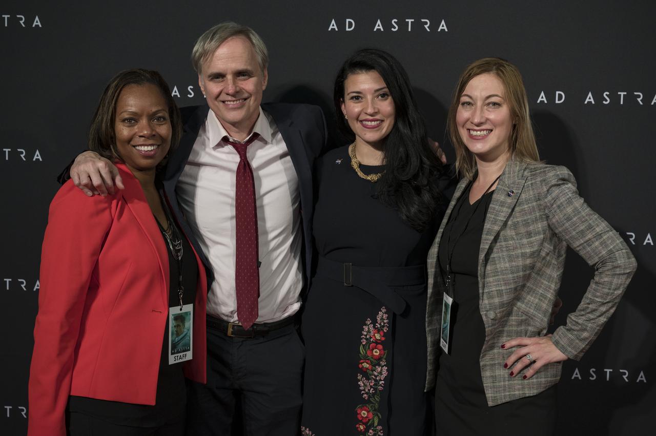 NASA staff, from left to right, Cindy Steele, Bert Ulrich, Bettina Inclán, and Cheryl Warner pose for a photo on the red carpet during a screening of the film "Ad Astra" at National Geographic Society, Monday, September 16, 2019 in Washington. The film was produced, co-written, and directed by James Gray and stars Pitt, Tommy Lee Jones, Ruth Negga, Liv Tyler, and Donald Sutherland. Pitt stars as astronaut Roy McBride who travels deep into the solar system in hopes of solving a mystery that threatens life on Earth. Photo Credit: (NASA/Aubrey Gemignani)