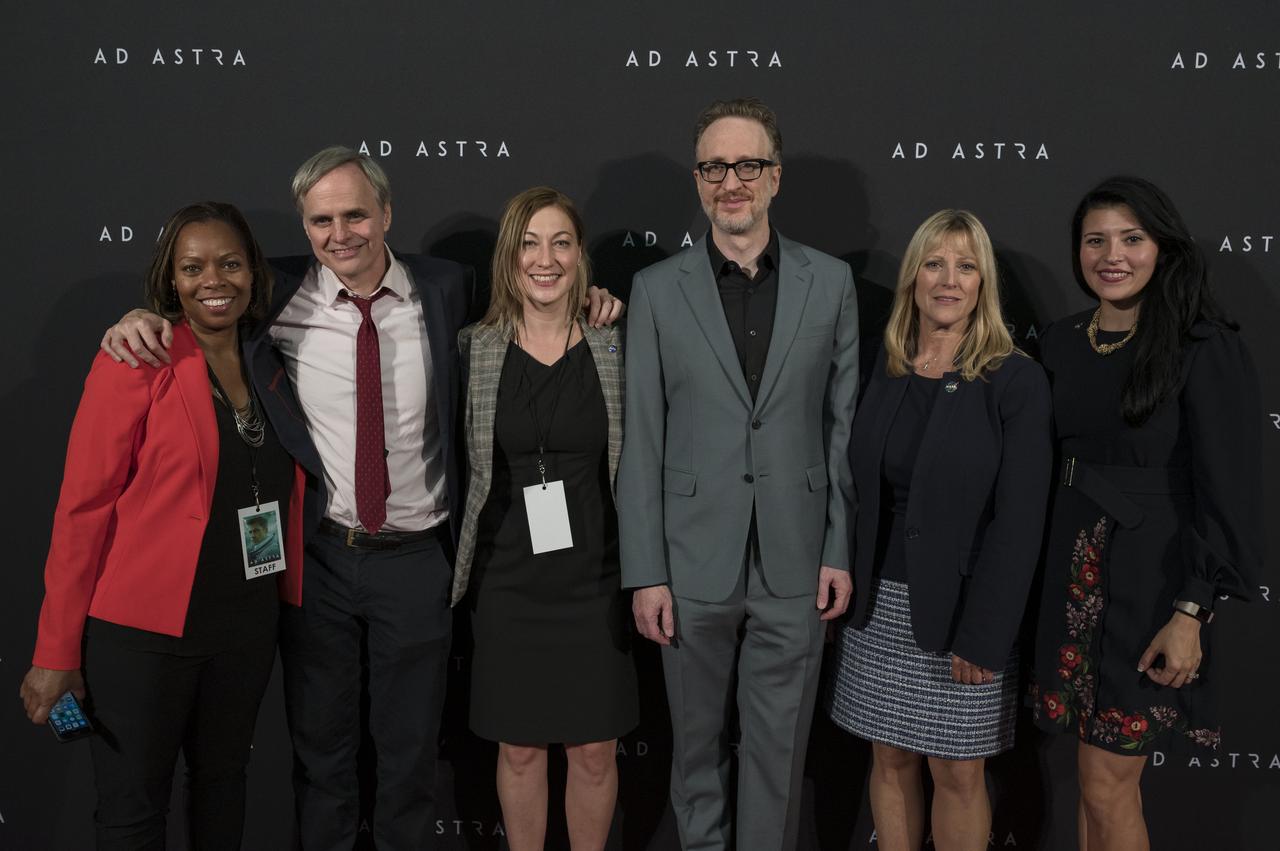 From left to right, NASA staff, Cindy Steele, Bert Ulrich, and Cheryl Warner, "Ad Astra" producer, co-writer, and director James Gray, former NASA astronaut Kay Hire, and NASA Associate Administrator for the Office of Communications, Bettina Inclán, pose for a photo on the red carpet during a screening of the film "Ad Astra" at National Geographic Society, Monday, September 16, 2019 in Washington. The film was produced, co-written, and directed by James Gray and stars Pitt, Tommy Lee Jones, Ruth Negga, Liv Tyler, and Donald Sutherland. Pitt stars as astronaut Roy McBride who travels deep into the solar system in hopes of solving a mystery that threatens life on Earth. Photo Credit: (NASA/Aubrey Gemignani)