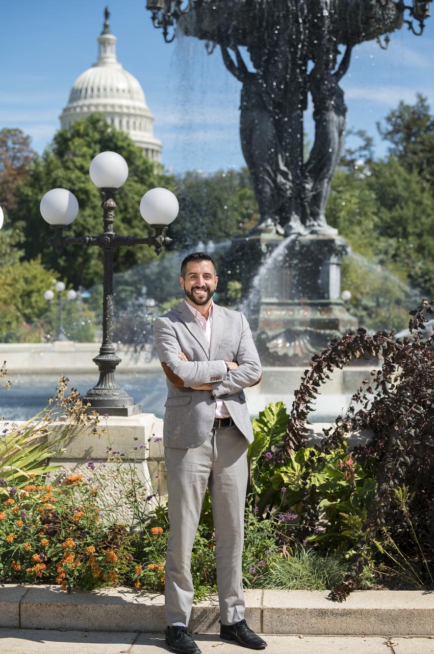 “When I first joined Twitter in 2009, one of the first accounts I followed was NASA. I knew they were doing NASA ‘Tweetups’ (now called Socials) where members of the public could apply, go behind the scenes of a NASA facility and potentially attend a launch. “I was selected for the STS-135 Tweetup — the final launch of the Space Shuttle, July 2011. The Tweetup gave me access that I never in my life thought I’d be able to experience. Being inside the Vehicle Assembly Building, where Saturn rockets were assembled, where the Space Shuttle was stacked and now where the SLS is going to be stacked… that for me, was incredible. “We got to Kennedy for the launch on July 7. There were severe thunderstorms and lightning all around. The weather was not looking good for the next day. “The next morning, we get to the press site, and the weather continues to look like it’s going to prevent the launch. There was a 30% chance. I didn’t think it was going to happen. “And then, there was a break in the clouds. And at 11:28 am, the Shuttle launches. It was such a physical, emotional experience. I remember feeling the sound waves. I was just so excited, so thrilled, so overcome by seeing all these people put in so many hours on something that was bigger than themselves, working toward making this mission a success. And that was the culmination of it: 5 million pounds of thrust lifting this vehicle 250 miles off the planet. “I thought, ‘wow, Atlantis took off with just a 30% chance.’ So, I try to take that with me whenever I face a challenging situation. And that’s kind of why I was teetering on not applying for my first NASA internship in 2013. But I thought to myself, ‘well, that vehicle took off in not-so-ideal conditions. Things aren’t impossible.’ That’s what led me to pursue this career at NASA.” Portrait, Andres Almeida, Thursday, September 19, 2019 at NASA Headquarters in Washington. Photo Credit: (NASA/Aubrey Gemignani)