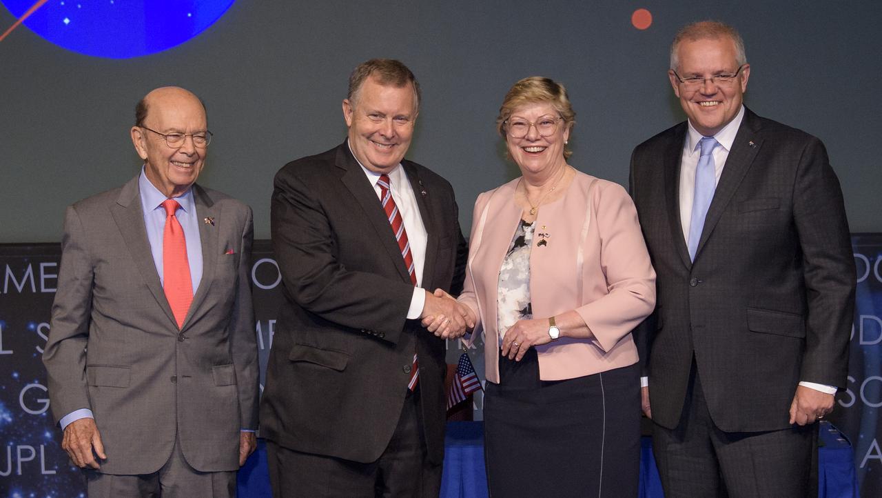 NASA Deputy Administrator Jim Morhard, second from left, shakes hands with Dr. Megan Clark, Head of the Australian Space Agency, second from right, as they pose for a photo with U.S. Secretary of Commerce Wilbur Ross, left, and Australian Prime Minister Scott Morrison, right, following the signing of a letter of intent between NASA and the Australian Space Agency, Saturday, Sept. 21, 2019 at NASA Headquarters in Washington. NASA and the Australian Space Agency will build on over 60 years of collaboration in space exploration between the two countries and commit to expanding cooperation. Photo Credit: (NASA/Joel Kowsky)