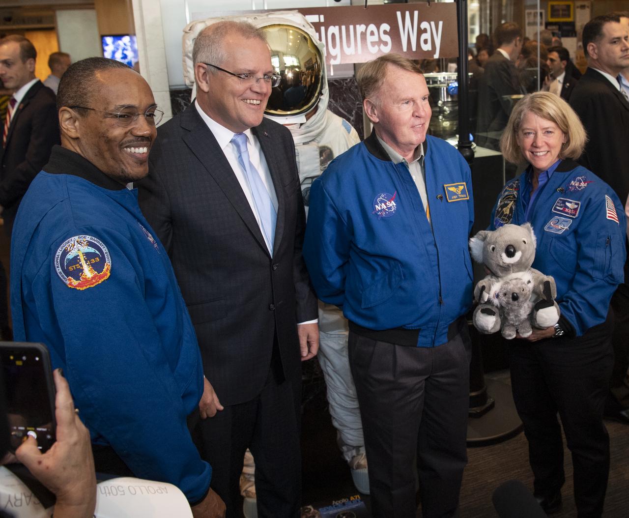 Australian Prime Minister Scott Morrison, second from left, poses for a picture with NASA astronaut Alvin Drew, left, and former NASA astronauts Andy Thomas, second from right, and Pam Melroy, right, following the signing of a letter of intent between NASA and the Australian Space Agency, Saturday, Sept. 21, 2019 at NASA Headquarters in Washington. NASA and the Australian Space Agency will build on over 60 years of collaboration in space exploration between the two countries and commit to expanding cooperation. Photo Credit: (NASA/Joel Kowsky)