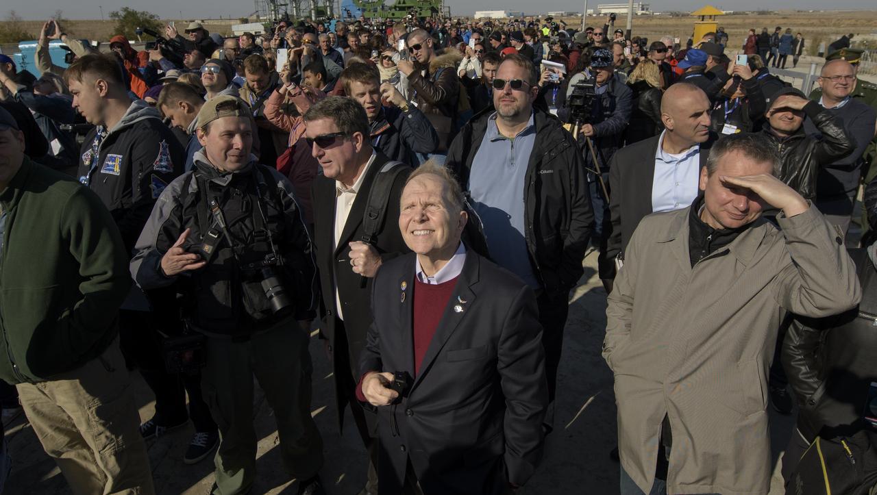 U.S. Ambassador to Kazakhstan William Moser, front center, and other launch guests watch as the Soyuz rocket is raised into vertical position on the launch pad, Monday, Sept. 23, 2019 at the Baikonur Cosmodrome in Kazakhstan. Expedition 61 crewmembers Jessica Meir of NASA, Oleg Skripochka of Roscosmos, and spaceflight participant Hazzaa Ali Almansoori of the United Arab Emirates will launch September 25th on the Soyuz MS-15 spacecraft from the Baikonur Cosmodrome to the International Space Station. Photo Credit: (NASA/Bill Ingalls)