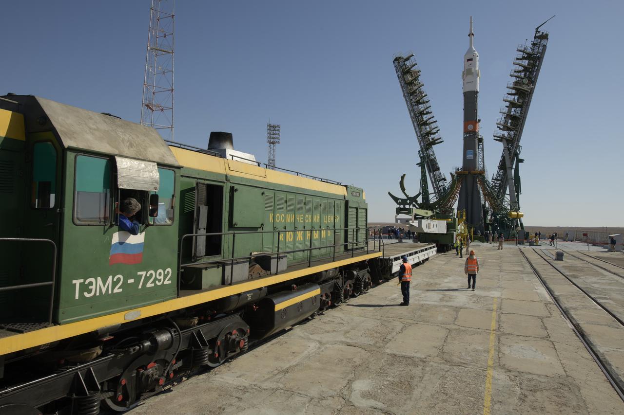 The gantry arms close around the Soyuz rocket after it was raised into vertical position on the launch pad, Monday, Sept. 23, 2019 at the Baikonur Cosmodrome in Kazakhstan. Expedition 61 crewmembers Jessica Meir of NASA, Oleg Skripochka of Roscosmos, and spaceflight participant Hazzaa Ali Almansoori of the United Arab Emirates will launch September 25th on the Soyuz MS-15 spacecraft from the Baikonur Cosmodrome to the International Space Station. Photo Credit: (NASA/Bill Ingalls)