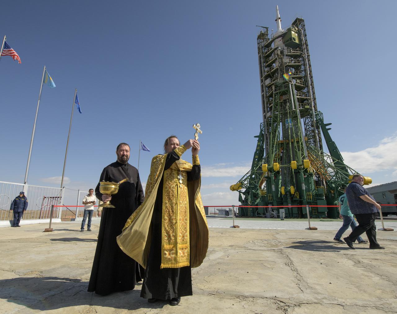 Russian Orthodox Priest Father Sergei blesses the Soyuz rocket and members of the media at the Baikonur Cosmodrome launch pad, Tuesday, Sept. 24, 2019 in Baikonur, Kazakhstan. Expedition 61 crew members Jessica Meir of NASA and Oleg Skripochka of Roscosmos, and spaceflight participant Hazzaa Ali Almansoori of the United Arab Emirates will launch September 25th on the Soyuz MS-15 spacecraft from the Baikonur Cosmodrome to the International Space Station. Photo Credit: (NASA/Bill Ingalls)