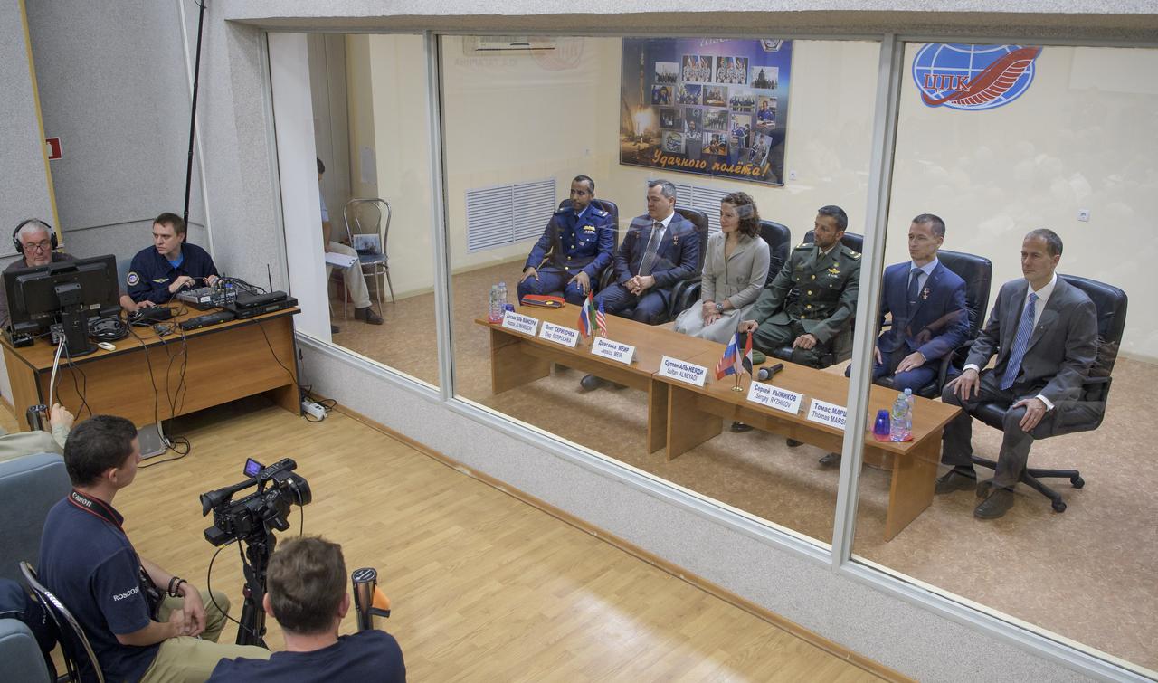 Spaceflight participant Hazzaa Ali Almansoori of the United Arab Emirates , left, Expedition 61 prime crew members Oleg Skripochka of Roscosmos and Jessica Meir of NASA, are seen with backup crew members spaceflight participant Sultan Al-Neyadi of the United Arab Emirates, Sergei Ryzhikov of Roscosmos and Thomas Marshburn of NASA, during the State Commission meeting to approve the crew's Soyuz launch to the International Space Station, Tuesday, Sept. 24, 2019 at the Cosmonaut Hotel in Baikonur, Kazakhstan. Meir, Skripochka and Almansoori will launch September 25th on the Soyuz MS-15 spacecraft from the Baikonur Cosmodrome to the International Space Station. Photo Credit: (NASA/Bill Ingalls)