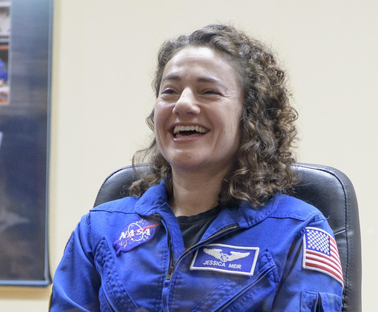 Expedition 61 astronaut Jessica Meir of NASA is seen during a press conference, Tuesday, Sept. 24, 2019 at the Cosmonaut Hotel in Baikonur, Kazakhstan. Meir, Expedition 61 cosmonaut Oleg Skripochka of Roscosmos and spaceflight participant Hazzaa Ali Almansoori of the United Arab Emirates will launch September 25th on the Soyuz MS-15 spacecraft from the Baikonur Cosmodrome to the International Space Station. Photo Credit: (NASA/Bill Ingalls)