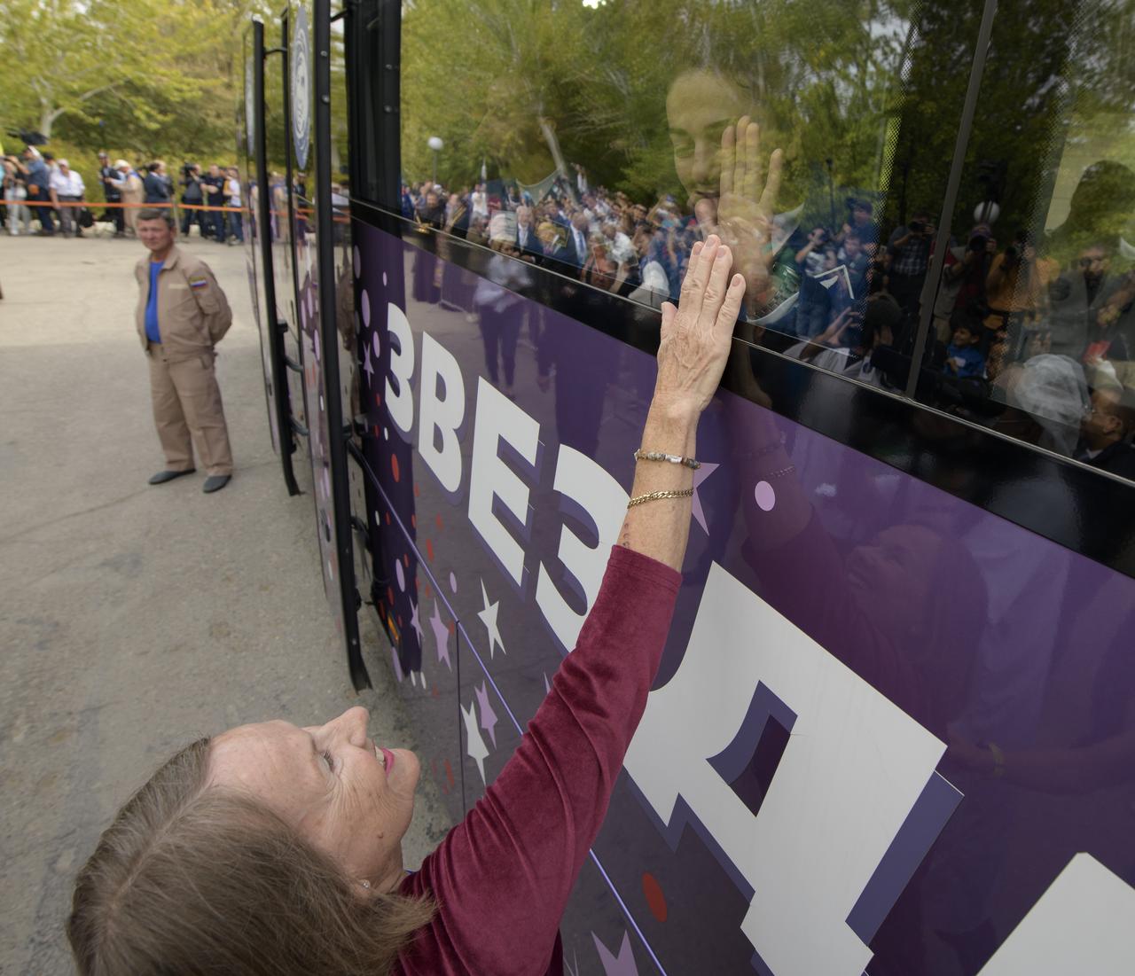 Expedition 61 crewmember Jessica Meir of NASA waves farewell to her mother as she, Expedition 61 cosmonaut Oleg Skripochka of Roscosmos and spaceflight participant Hazzaa Ali Almansoori of the United Arab Emirates depart the Cosmonaut Hotel ahead of their Soyuz launch to the International Space Station, Wednesday, Sept. 25, 2019 in Baikonur, Kazakhstan. Meir, Skripochka, and Almansoori will launch on the Soyuz MS-15 spacecraft from the Baikonur Cosmodrome to the International Space Station. Photo Credit: (NASA/Bill Ingalls)