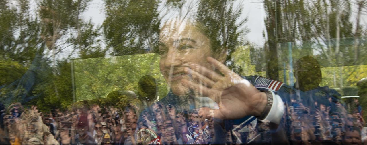 Expedition 61 crewmember Jessica Meir of NASA waves farewell as she, Expedition 61 cosmonaut Oleg Skripochka of Roscosmos and spaceflight participant Hazzaa Ali Almansoori of the United Arab Emirates depart the Cosmonaut Hotel ahead of their Soyuz launch to the International Space Station, Wednesday, Sept. 25, 2019 in Baikonur, Kazakhstan. Meir, Skripochka, and Almansoori will launch on the Soyuz MS-15 spacecraft from the Baikonur Cosmodrome to the International Space Station. Photo Credit: (NASA/Bill Ingalls)