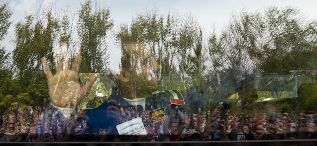 Spaceflight participant Hazzaa Ali Almansoori of the United Arab Emirates waves farewell as he, Expedition 61 crewmembers Oleg Skripochka of Roscosmos and Jessica Meir of NASA depart the Cosmonaut Hotel ahead of their Soyuz launch to the International Space Station, Wednesday, Sept. 25, 2019 in Baikonur, Kazakhstan. Meir, Skripochka, and Almansoori will launch on the Soyuz MS-15 spacecraft from the Baikonur Cosmodrome to the International Space Station. Photo Credit: (NASA/Bill Ingalls)