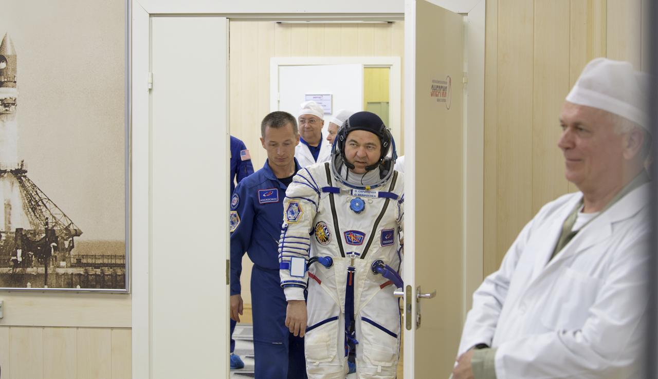 Expedition 61 cosmonaut Oleg Skripochka of Roscosmos prepares to have his Sokol suit pressure checked a few hours ahead of his launch on a Soyuz rocket with Expedition 61 astronaut Jessica Meir of NASA and spaceflight participant Hazzaa Ali Almansoori of the United Arab Emirates, Wednesday, Sept. 25, 2019 at the Baikonur Cosmodrome in Kazakhstan. Meir, Skripochka, and Almansoori will launch on the Soyuz MS-15 spacecraft from the Baikonur Cosmodrome to the International Space Station. Photo Credit: (NASA/Bill Ingalls)