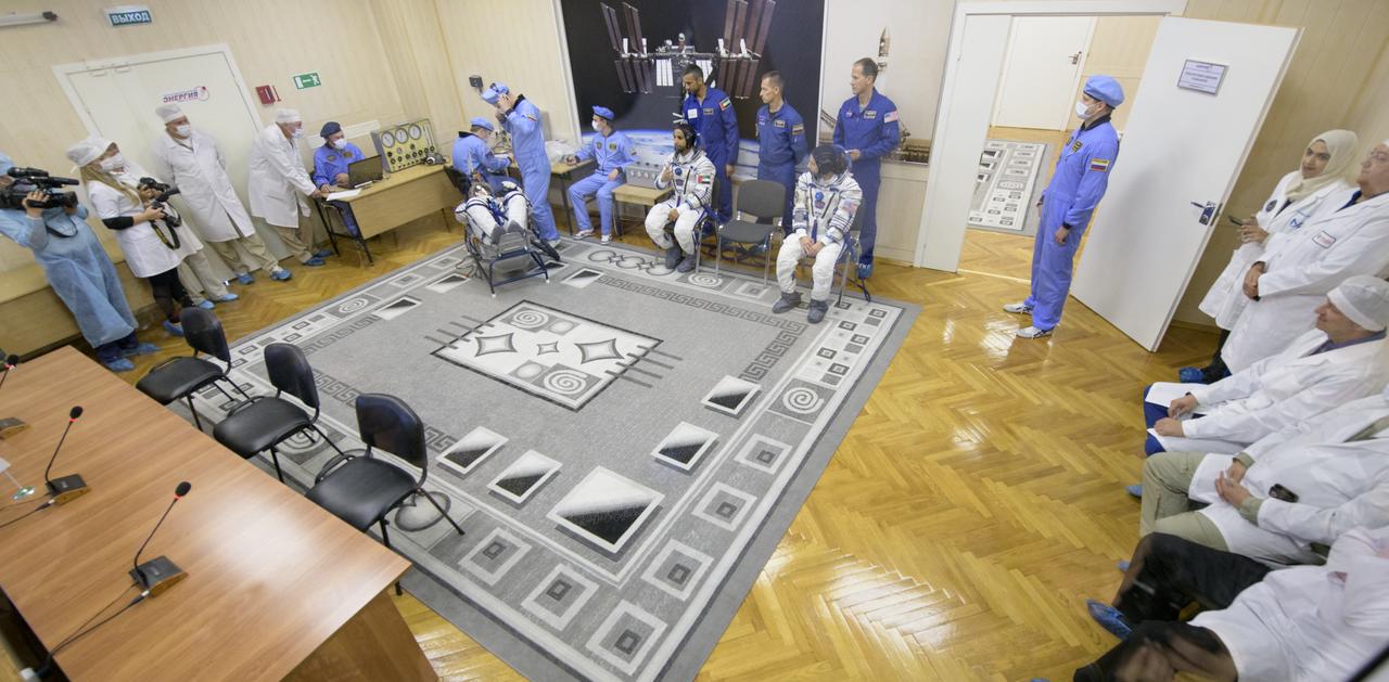 Expedition 61 cosmonaut Oleg Skripochka of Roscosmos, spaceflight participant Hazzaa Ali Almansoori of the United Arab Emirates and Expedition 61 astronaut Jessica Meir of NASA have their Sokol suits pressure checked a few hours ahead of their launch on a Soyuz rocket, Wednesday, Sept. 25, 2019 at the Baikonur Cosmodrome in Kazakhstan. Meir, Skripochka, and Almansoori will launch on the Soyuz MS-15 spacecraft from the Baikonur Cosmodrome to the International Space Station. Photo Credit: (NASA/Bill Ingalls)