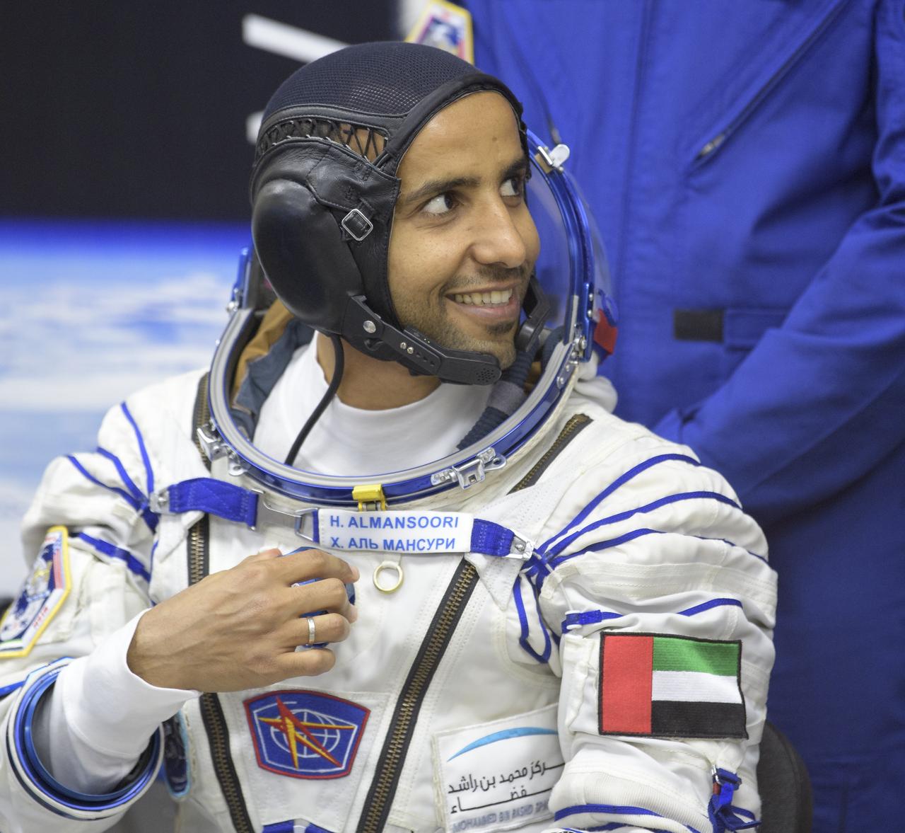 Spaceflight participant Hazzaa Ali Almansoori of the United Arab Emirates waits to have his Sokol suit pressure checked a few hours ahead of his launch on a Soyuz rocket with Expedition 61 crewmembers Jessica Meir of NASA and Oleg Skripochka of Roscosmos, Wednesday, Sept. 25, 2019 at the Baikonur Cosmodrome in Kazakhstan. Meir, Skripochka, and Almansoori will launch on the Soyuz MS-15 spacecraft from the Baikonur Cosmodrome to the International Space Station. Photo Credit: (NASA/Bill Ingalls)
