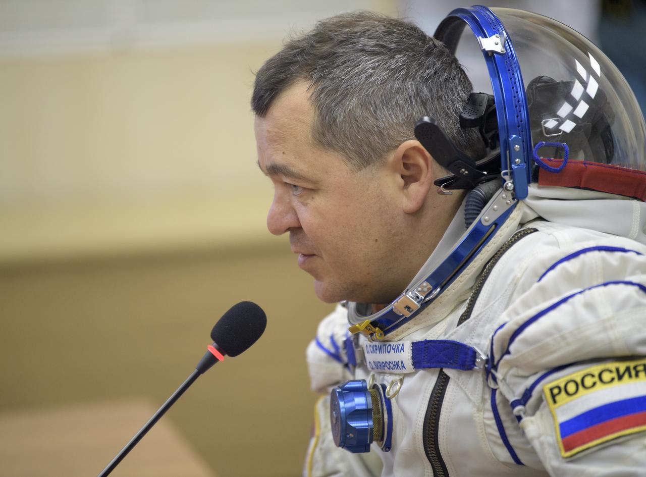 Expedition 61 cosmonaut Oleg Skripochka of Roscosmos talks with family after having his Sokol suit pressure checked a few hours ahead of his launch on a Soyuz rocket with Expedition 61 astronaut Jessica Meir of NASA and spaceflight participant Hazzaa Ali Almansoori of the United Arab Emirates, Wednesday, Sept. 25, 2019 at the Baikonur Cosmodrome in Kazakhstan. Meir, Skripochka, and Almansoori will launch on the Soyuz MS-15 spacecraft from the Baikonur Cosmodrome to the International Space Station. Photo Credit: (NASA/Bill Ingalls)