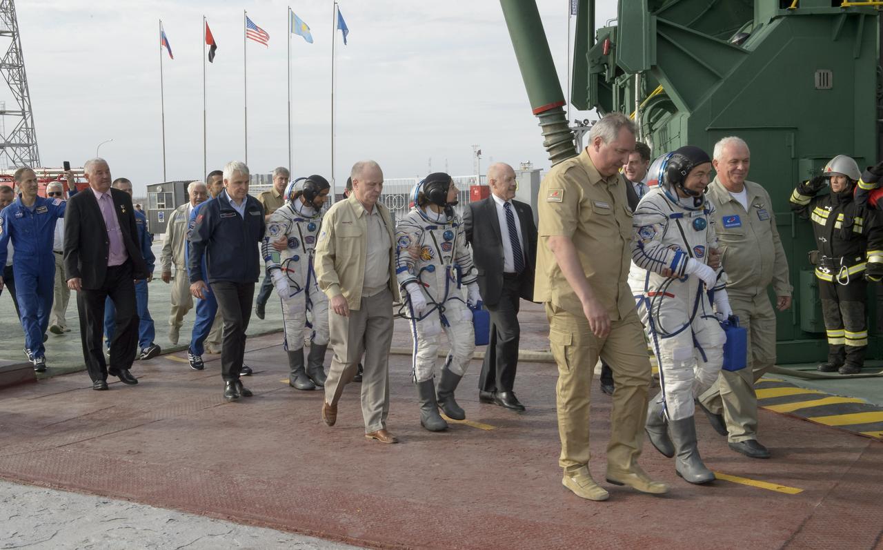 Spaceflight participant Hazzaa Ali Almansoori of the United Arab Emirates, left, Expedition 61 astronaut Jessica Meir of NASA, center, and Expedition 61 cosmonaut Oleg Skripochka of Roscosmos prepare to board the Soyuz MS-15 spacecraft for launch, Wednesday, Sept. 25, 2019 at the Baikonur Cosmodrome in Kazakhstan. Meir, Skripochka, and Almansoori will launch from the Baikonur Cosmodrome to the International Space Station. Photo Credit: (NASA/GCTC/Irina Spector)
