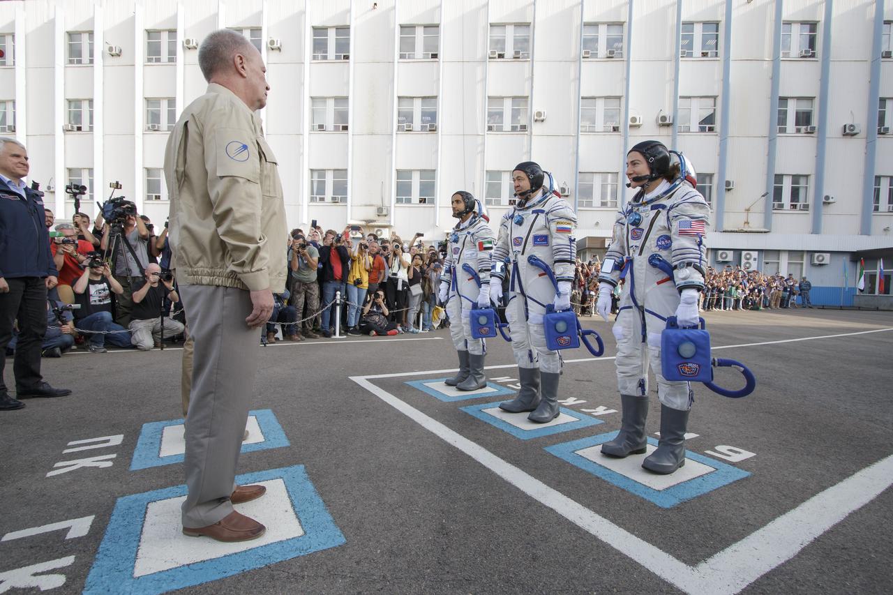 Roscosmos leadership is seen speaking with Spaceflight participant Hazzaa Ali Almansoori of the United Arab Emirates, left, Expedition crewmembers Oleg Skripochka of Roscosmos, and Jessica Meir of NASA, right, prior to the crew’s launch onboard the Soyuz TM-15 spacecraft, Wednesday, Sept. 25, 2019 at the Baikonur Cosmodrome in Kazakhstan. Meir, Skripochka, and Almansoori will launch from the Baikonur Cosmodrome to the International Space Station. Photo Credit: (NASA/Victor Zelentsov)