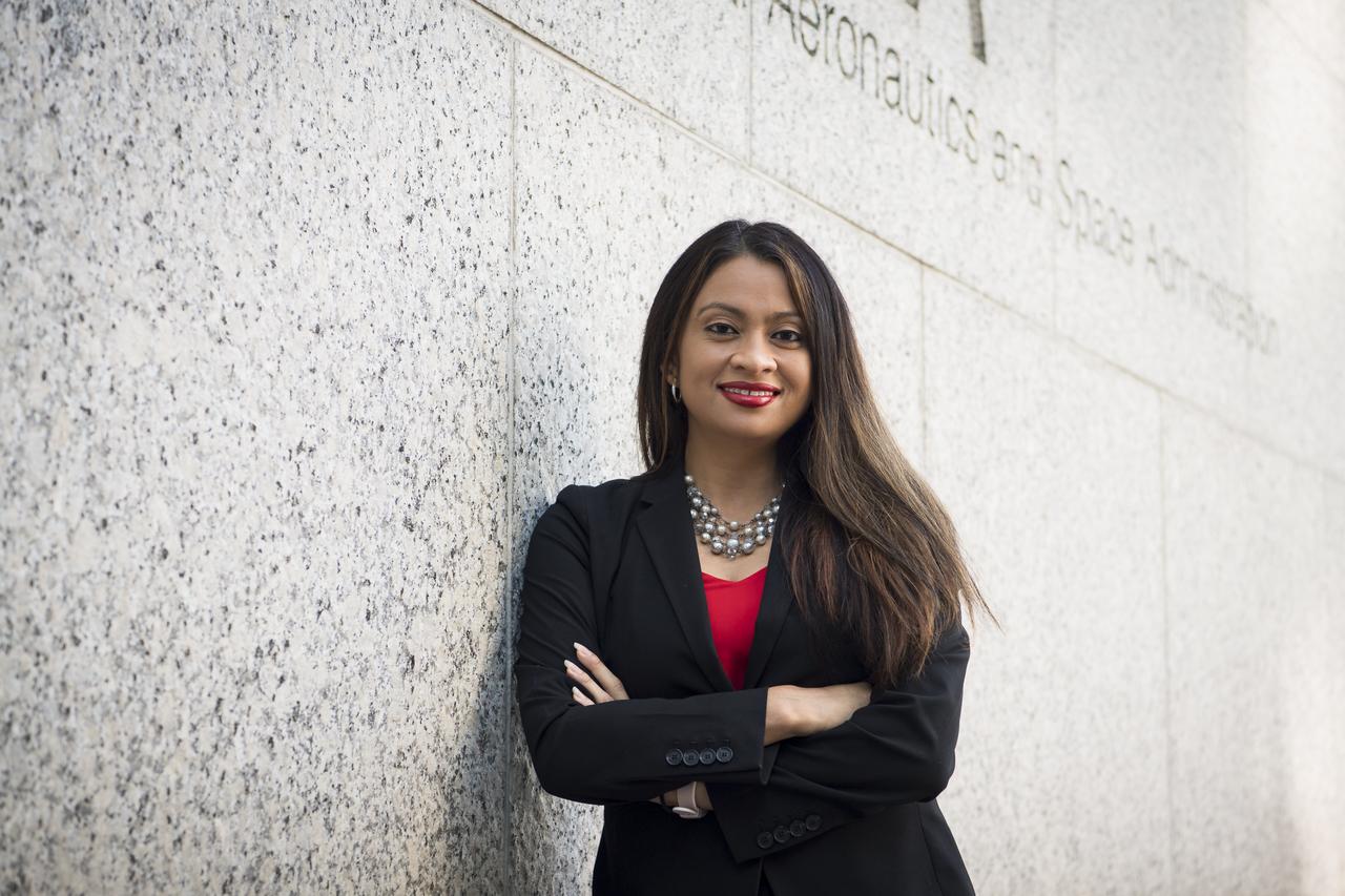 "For me, representation is key. I want people from different backgrounds, different experiences, and different races and ethnicities to see themselves at this agency and across federal government, which is supposed to be representative of the American population. Especially for little girls like me — I grew up poor, the daughter of a former migrant worker. I grew up working in the fields, picking fruits and vegetables during weekends and school breaks.  "I’m the first one in my family to get a four-year degree. I didn’t do it because it was what I was expected to do or because it was the obvious next step. I was able to go because I had teachers and advisors who saw potential even when I couldn’t. I was a first generation college student, and now I have nieces and nephews who have obtained or are in the process of obtaining their education."  "It’s not only about opening doors, it’s about opening minds — giving people a vision of the possibilities that are out there. Because now you’re broadening that thinking. You’re helping them question their status quo and helping them to see a different version of themselves. When you meet someone who is doing something different but yet, you can relate to them because of what they look like or their background, it makes a huge difference." Portrait, Maria Santos, Tuesday, Oct.1, 2019 at NASA Headquarters in Washington. Photo Credit: (NASA/Aubrey Gemignani)