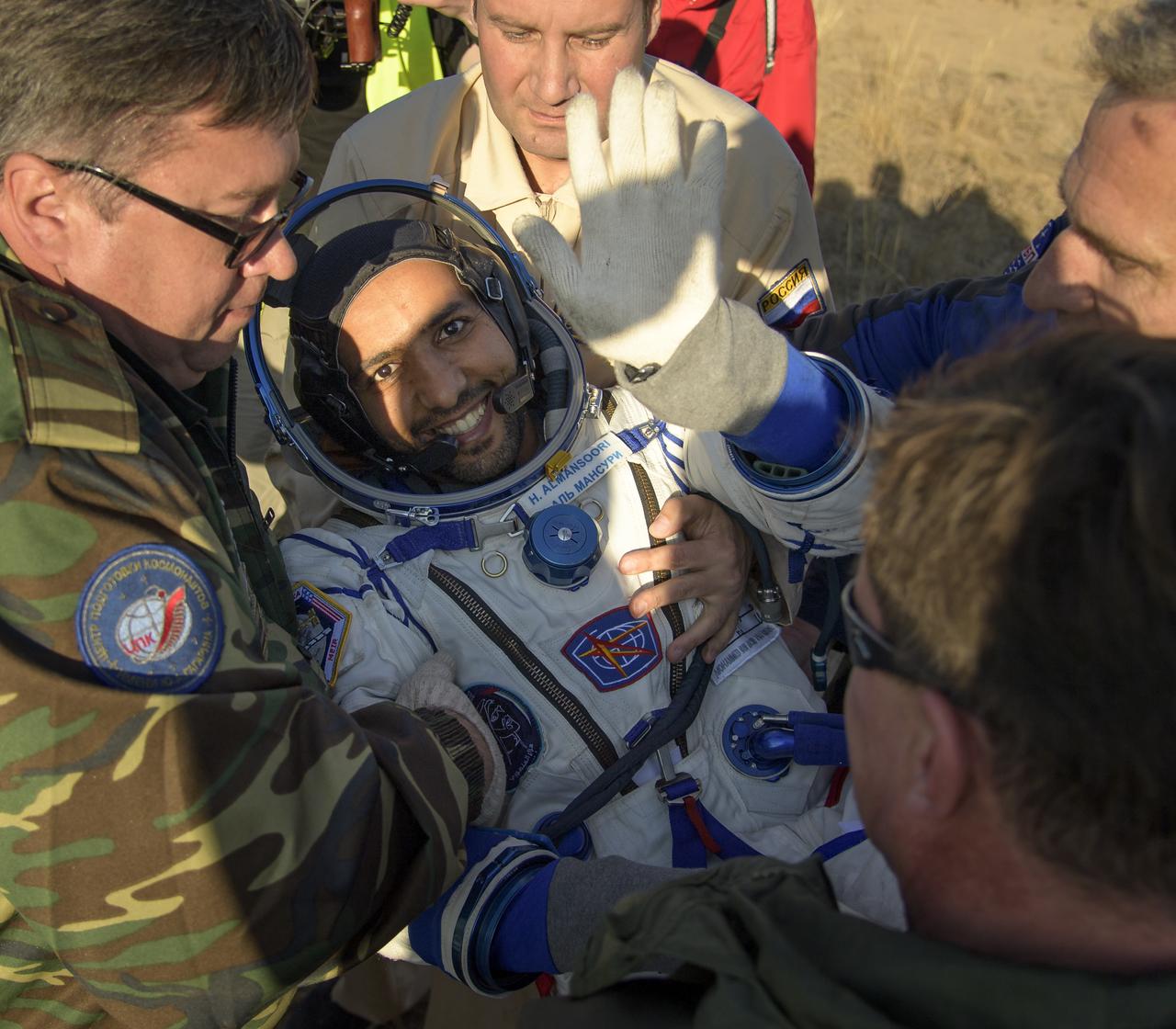 Visiting astronaut Hazzaa Ali Almansoori of the United Arab Emirates is helped out of the Soyuz MS-12 spacecraft just minutes after he and Expedition 60 crewmembers Alexey Ovchinin of Roscosmos and Nick Hague of NASA landed in a remote area near the town of Zhezkazgan, Kazakhstan on Thursday, Oct. 3, 2019. Hague and Ovchinin are returning after 203 days in space where they served as members of the Expedition 59 and 60 crews onboard the International Space Station. Almansoori logged 8 days in space during his first flight as an astronaut. Photo Credit: (NASA/Bill Ingalls)