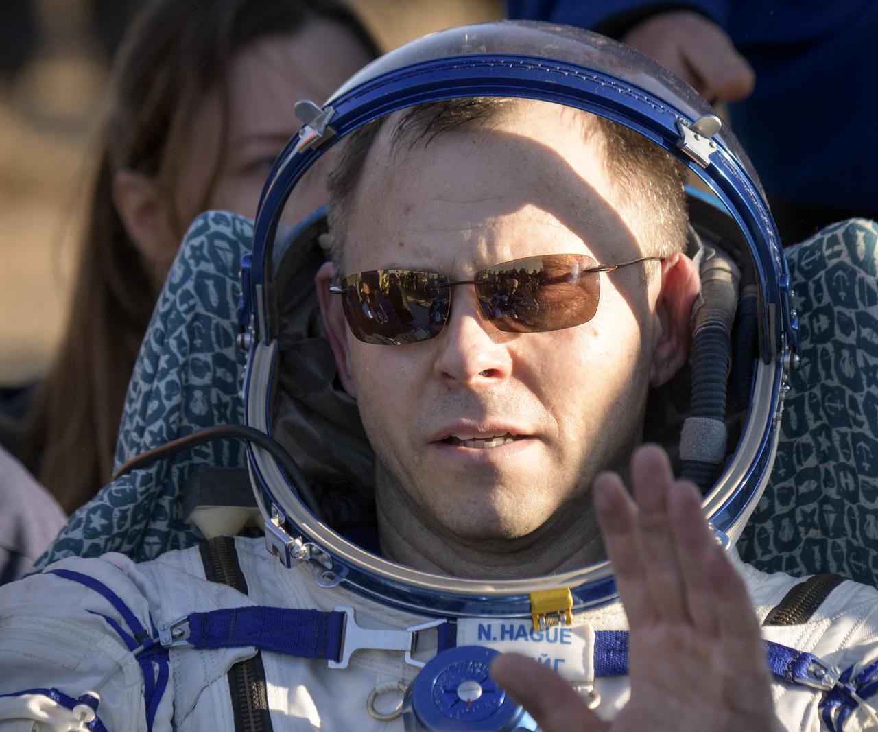 Expedition 60 crewmember Nick Hague of NASA is seen outside the Soyuz MS-12 spacecraft after he landed with fellow crewmember Alexey Ovchinin of Roscosmos and visiting astronaut Hazzaa Ali Almansoori of the United Arab Emirates in a remote area near the town of Zhezkazgan, Kazakhstan on Thursday, Oct. 3, 2019. Hague and Ovchinin are returning after 203 days in space where they served as members of the Expedition 59 and 60 crews onboard the International Space Station. Almansoori logged 8 days in space during his first flight as an astronaut. Photo Credit: (NASA/Bill Ingalls)