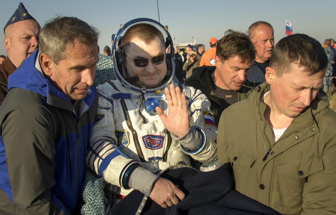 Expedition 60 crewmember Alexey Ovchinin of Roscosmos is carried to a medical tent shortly after he and fellow crewmember Nick Hague of NASA, and visiting astronaut Hazzaa Ali Almansoori of the United Arab Emirates landed in their Soyuz MS-12 spacecraft near the town of Zhezkazgan, Kazakhstan on Thursday, Oct. 3, 2019. Hague and Ovchinin are returning after 203 days in space where they served as members of the Expedition 59 and 60 crews onboard the International Space Station. Almansoori logged 8 days in space during his first flight as an astronaut. Photo Credit: (NASA/Bill Ingalls)