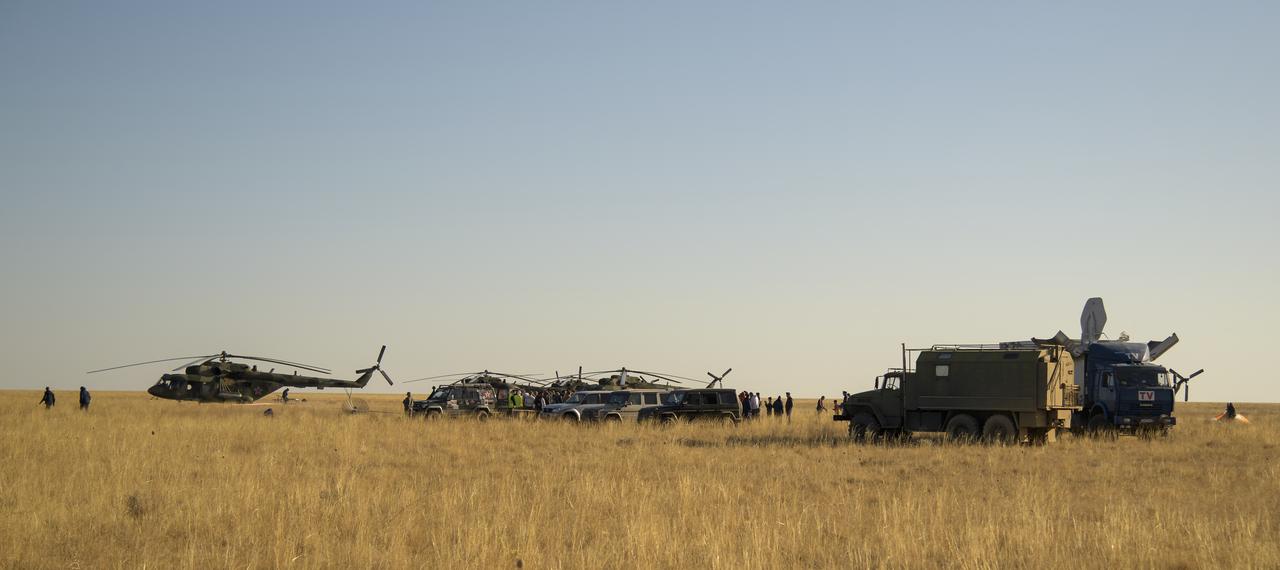 Russian Search and Rescue teams arrive at the Soyuz MS-12 spacecraft shortly after it landed with Expedition 60 crew members Nick Hague of NASA and Alexey Ovchinin of Roscosmos, along with visiting astronaut Hazzaa Ali Almansoori of the United Arab Emirates, Thursday, Oct. 3, 2019. Hague and Ovchinin are returning after 203 days in space where they served as members of the Expedition 59 and 60 crews onboard the International Space Station. Almansoori logged 8 days in space during his first flight as an astronaut. Photo Credit: (NASA/Bill Ingalls)